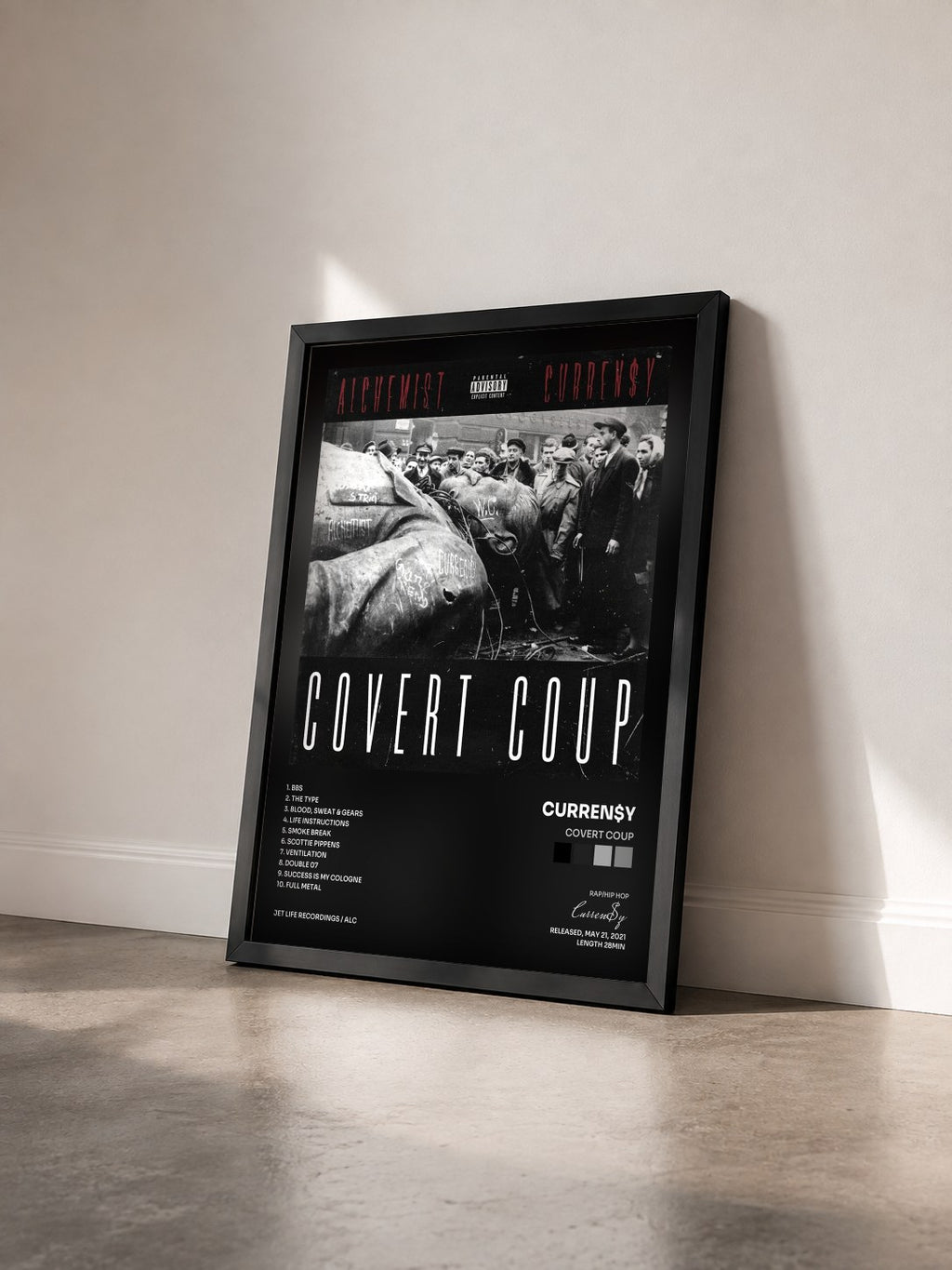 #noir Tableau de l'album Covert Coup de Curren$y vu de trois quarts, cadre noir