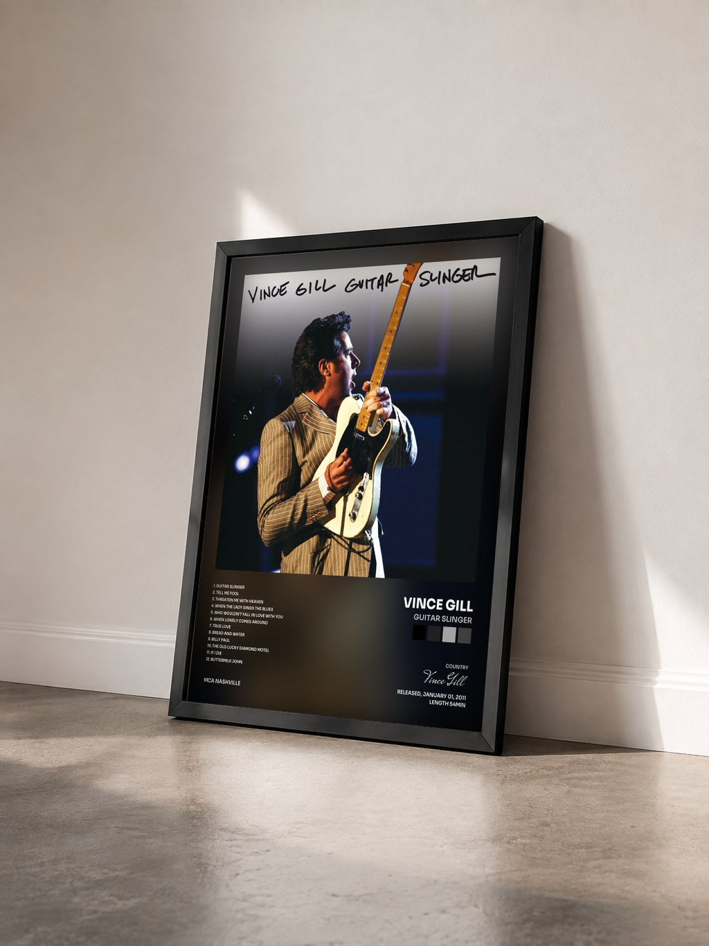 #noir Tableau de l'album Guitar Slinger de Vince Gill vu de trois quarts, cadre noir