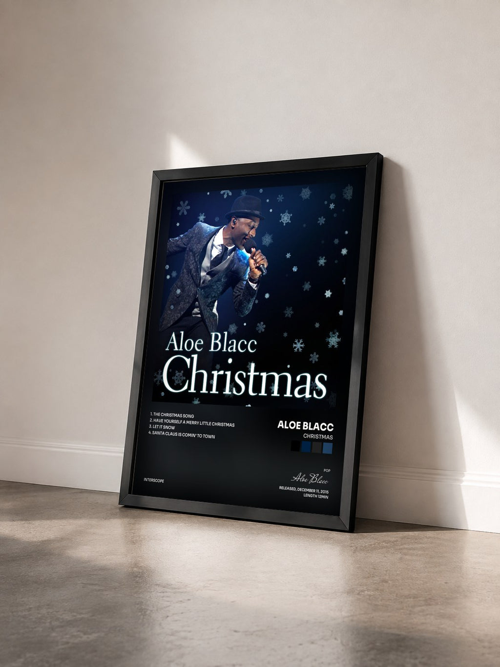 #noir Tableau de l'album Christmas de Aloe Blacc vu de trois quarts, cadre noir
