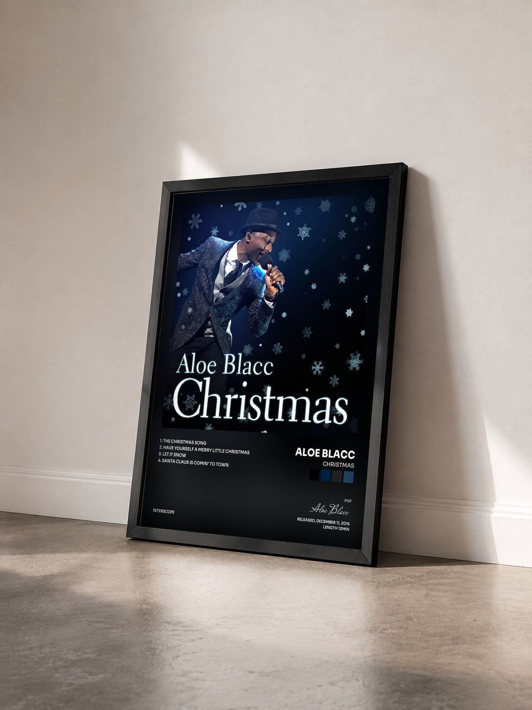 #noir Tableau de l'album Christmas de Aloe Blacc vu de trois quarts, cadre noir