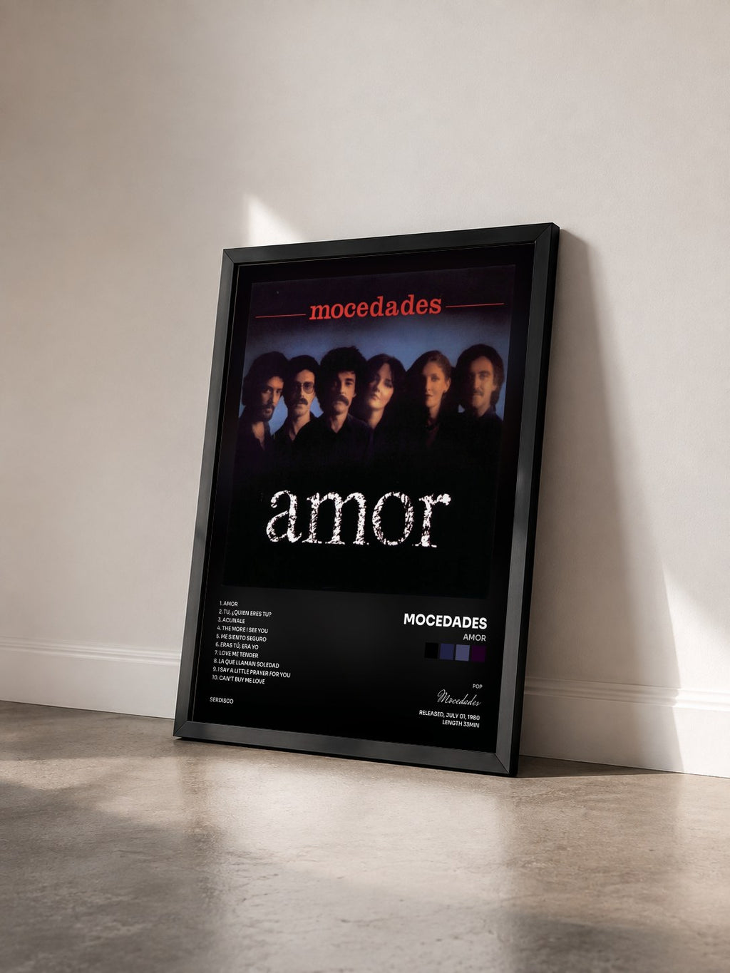 #noir Tableau de l'album Amor de Mocedades vu de trois quarts, cadre noir