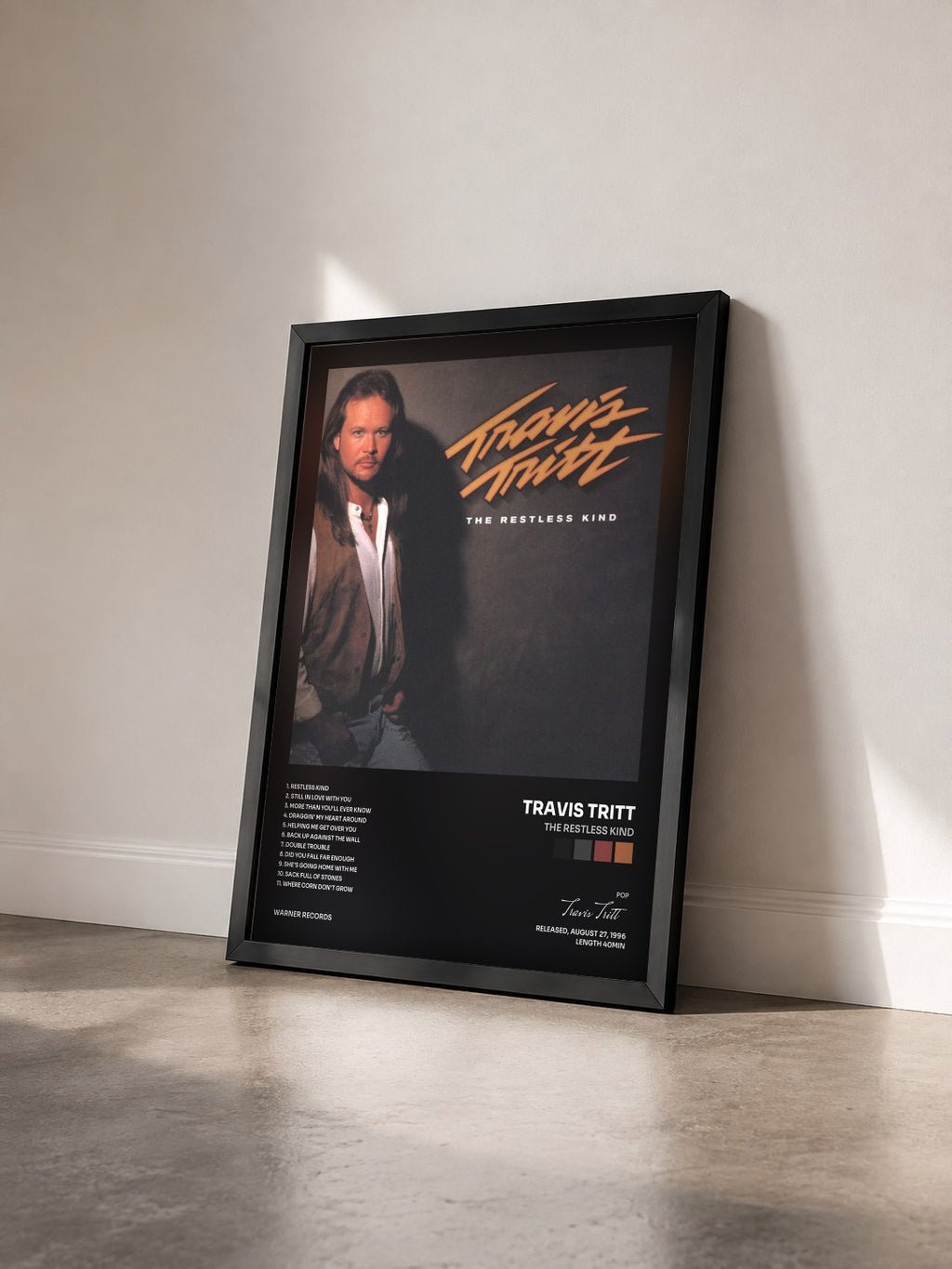#noir Tableau de l'album The Restless Kind de Travis Tritt vu de trois quarts, cadre noir
