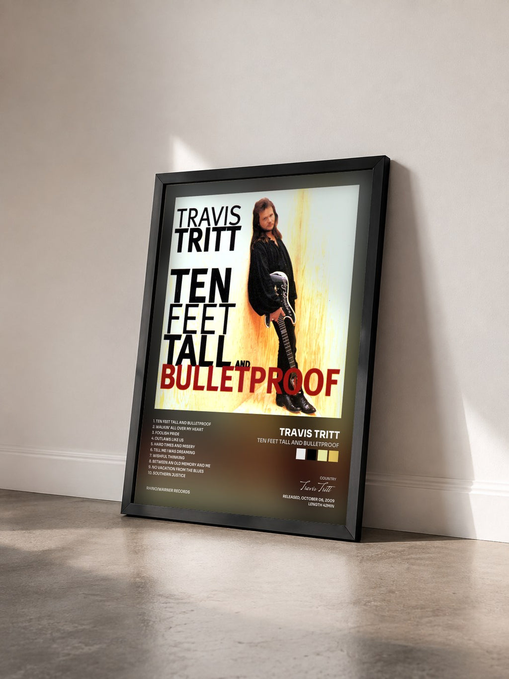 #noir Tableau de l'album Ten Feet Tall and Bulletproof de Travis Tritt vu de trois quarts, cadre noir
