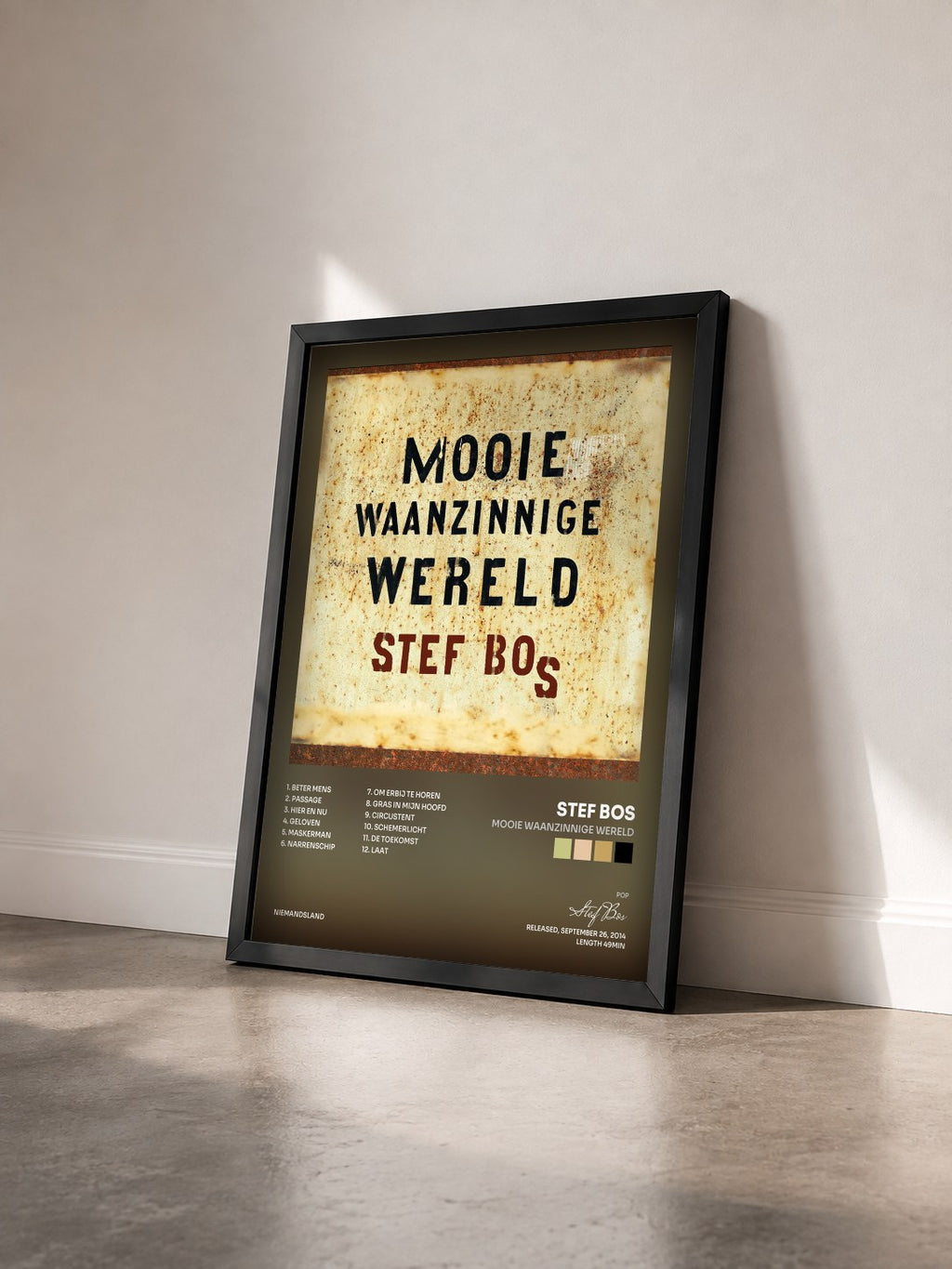 #noir Tableau de l'album Mooie Waanzinnige Wereld de Stef Bos vu de trois quarts, cadre noir