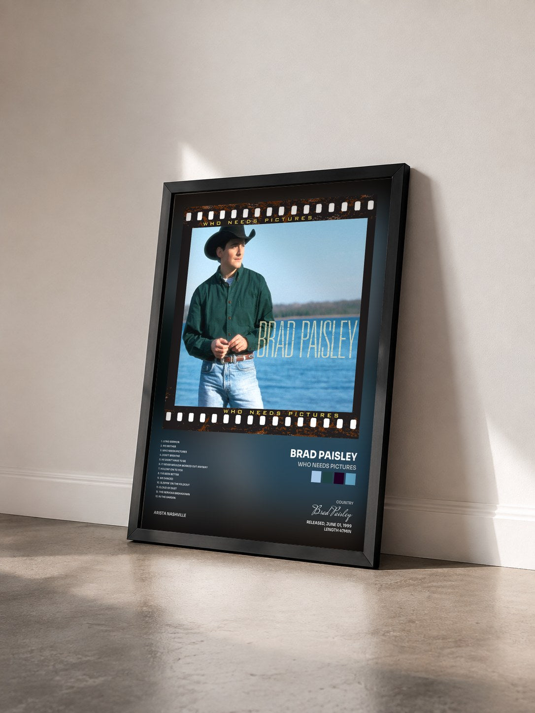 #noir Tableau de l'album Who Needs Pictures de Brad Paisley vu de trois quarts, cadre noir