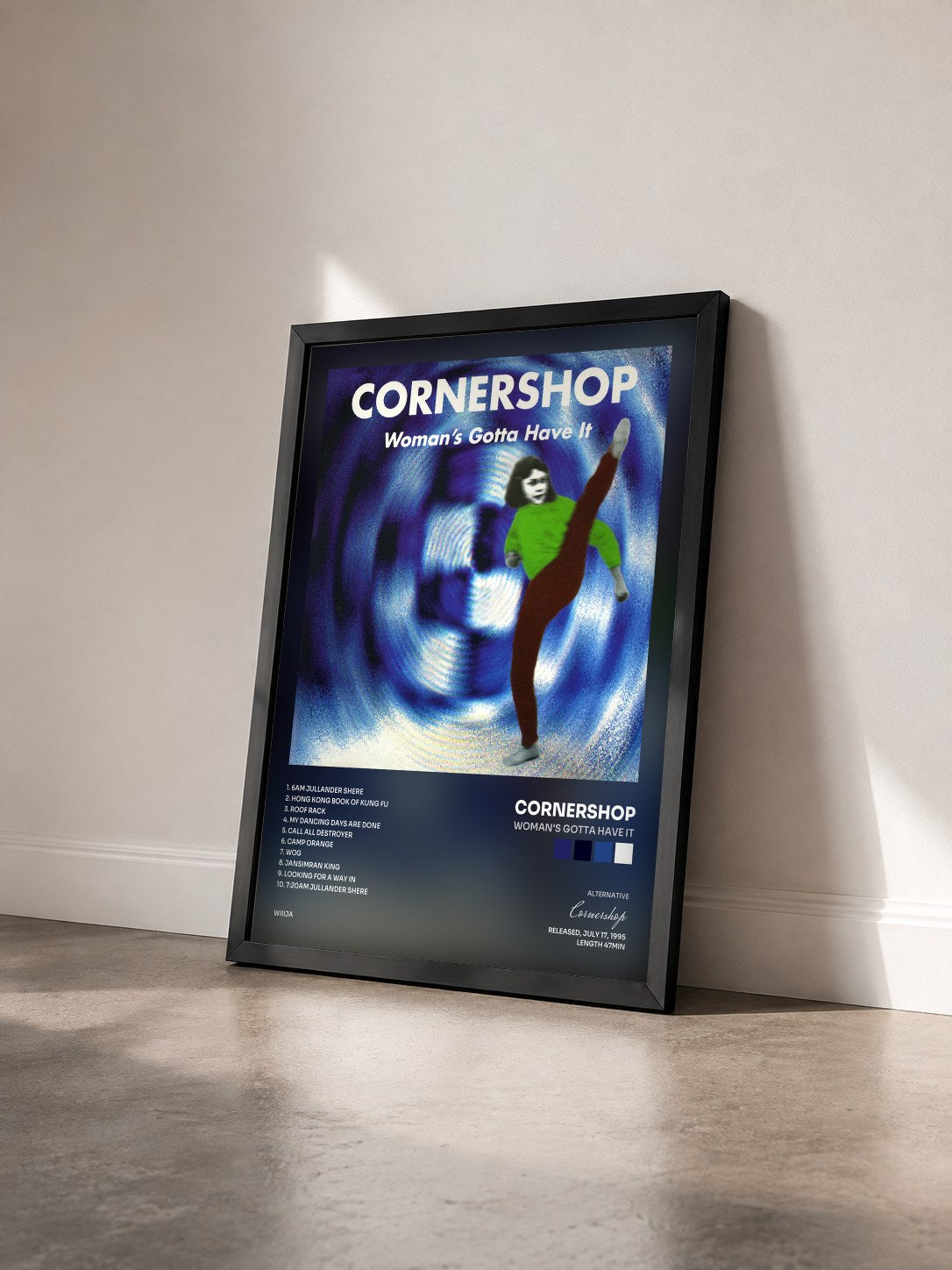 #noir Tableau de l'album Woman's Gotta Have It de Cornershop vu de trois quarts, cadre noir