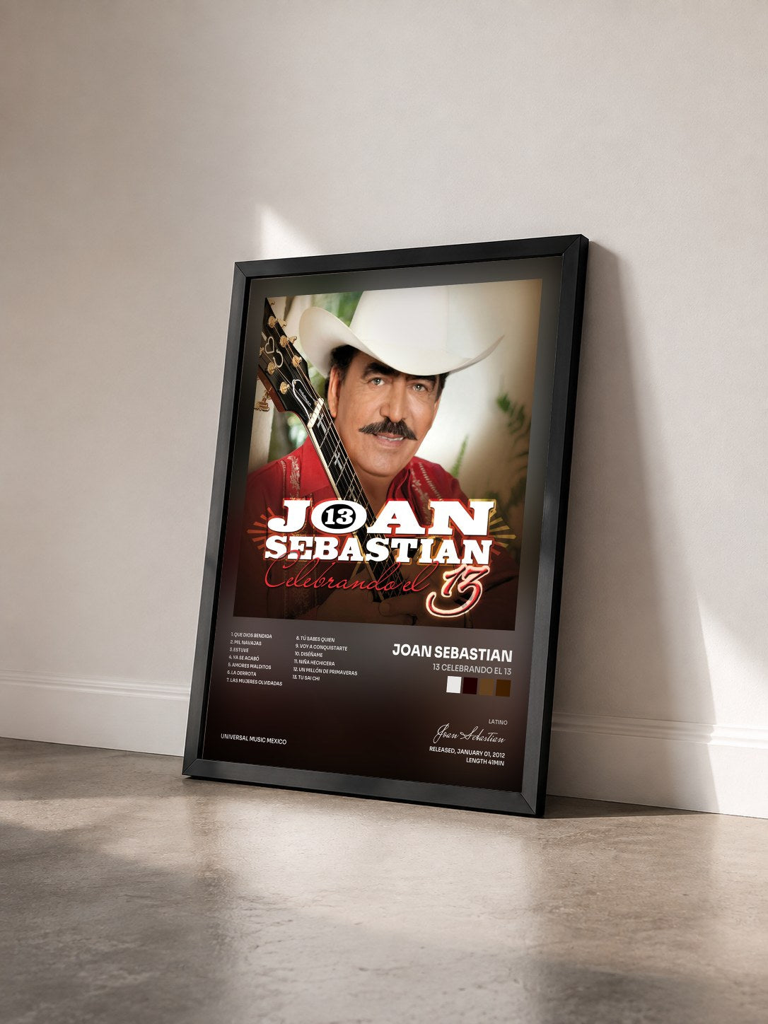 #noir Tableau de l'album 13 Celebrando El 13 de Joan Sebastian vu de trois quarts, cadre noir