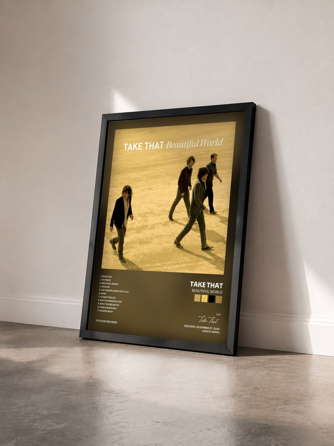 #noir Tableau de l'album Beautiful World de Take That vu de trois quarts, cadre noir