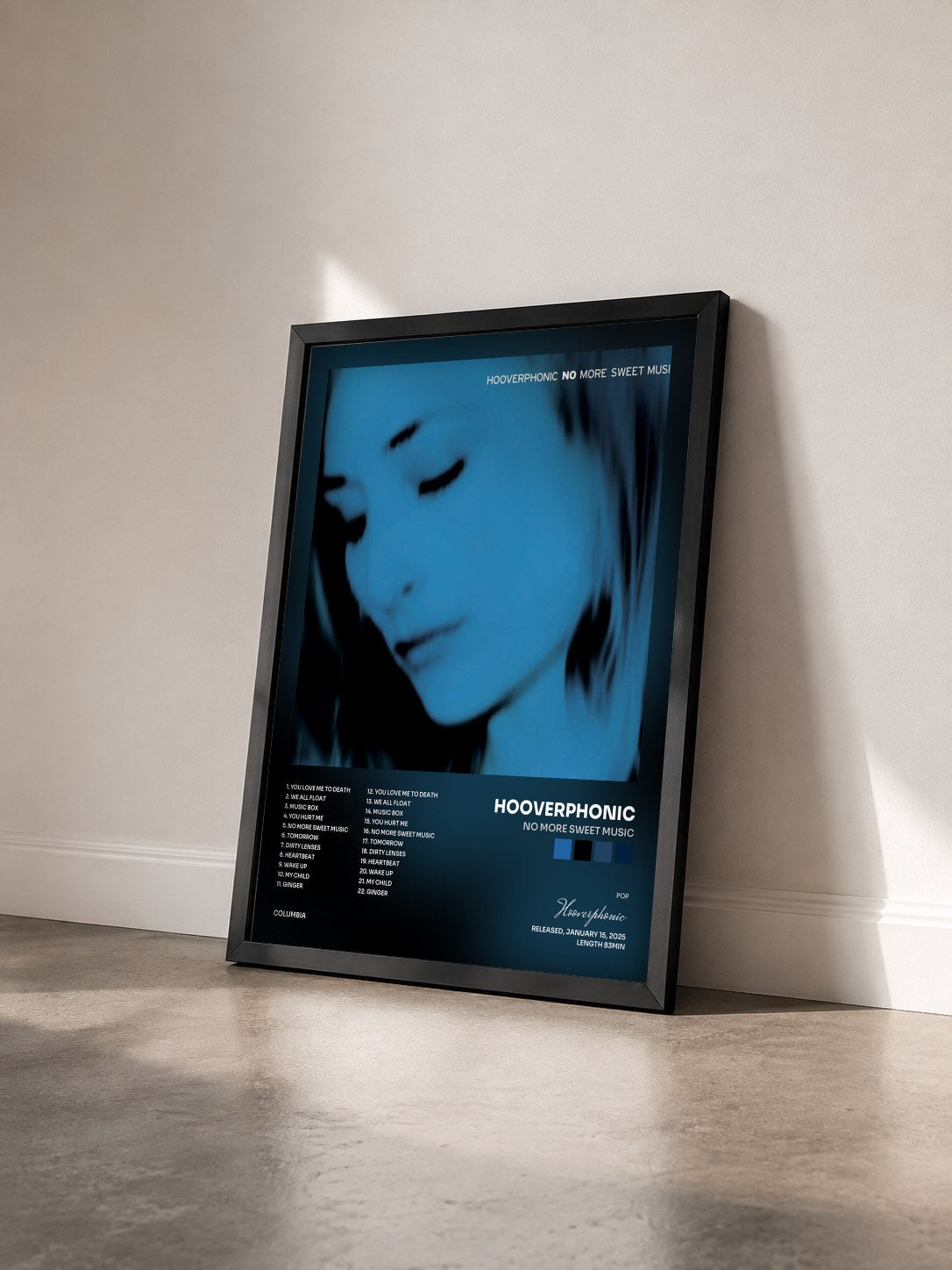 #noir Tableau de l'album No More Sweet Music de Hooverphonic vu de trois quarts, cadre noir