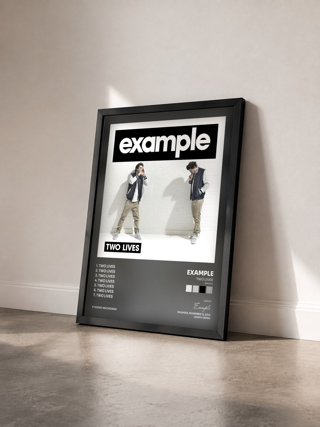 #noir Tableau de l'album Two Lives (Remixes) de Example vu de trois quarts, cadre noir