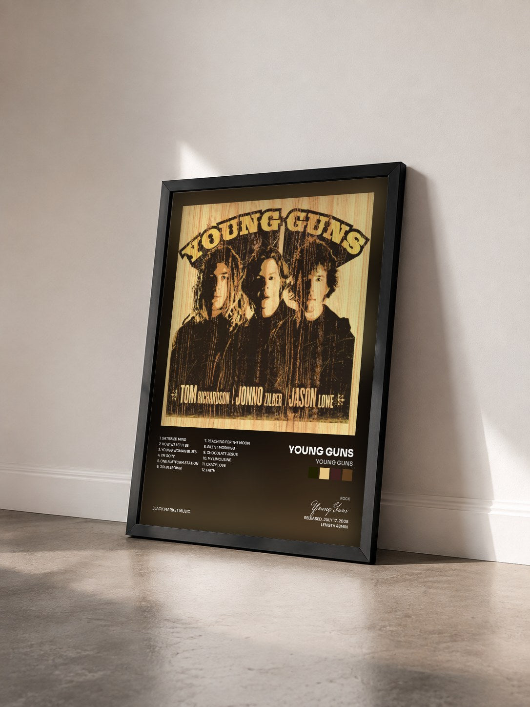 #noir Tableau de l'album Young Guns de Young Guns vu de trois quarts, cadre noir