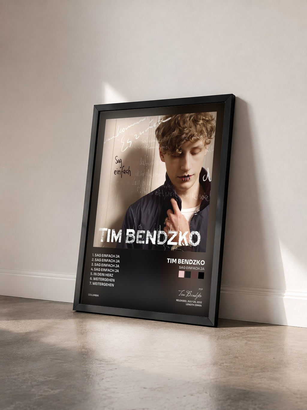 #noir Tableau de l'album Sag einfach ja de Tim Bendzko vu de trois quarts, cadre noir