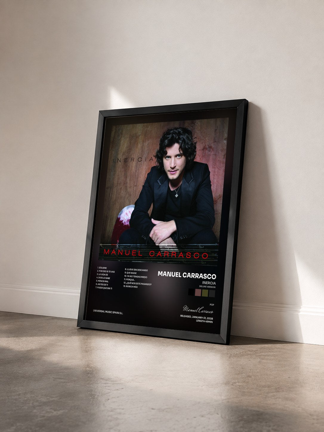 #noir Tableau de l'album Inercia (Deluxe Version) de Manuel Carrasco vu de trois quarts, cadre noir