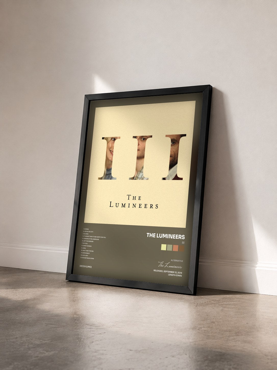 #noir Tableau de l'album III de The Lumineers vu de trois quarts, cadre noir
