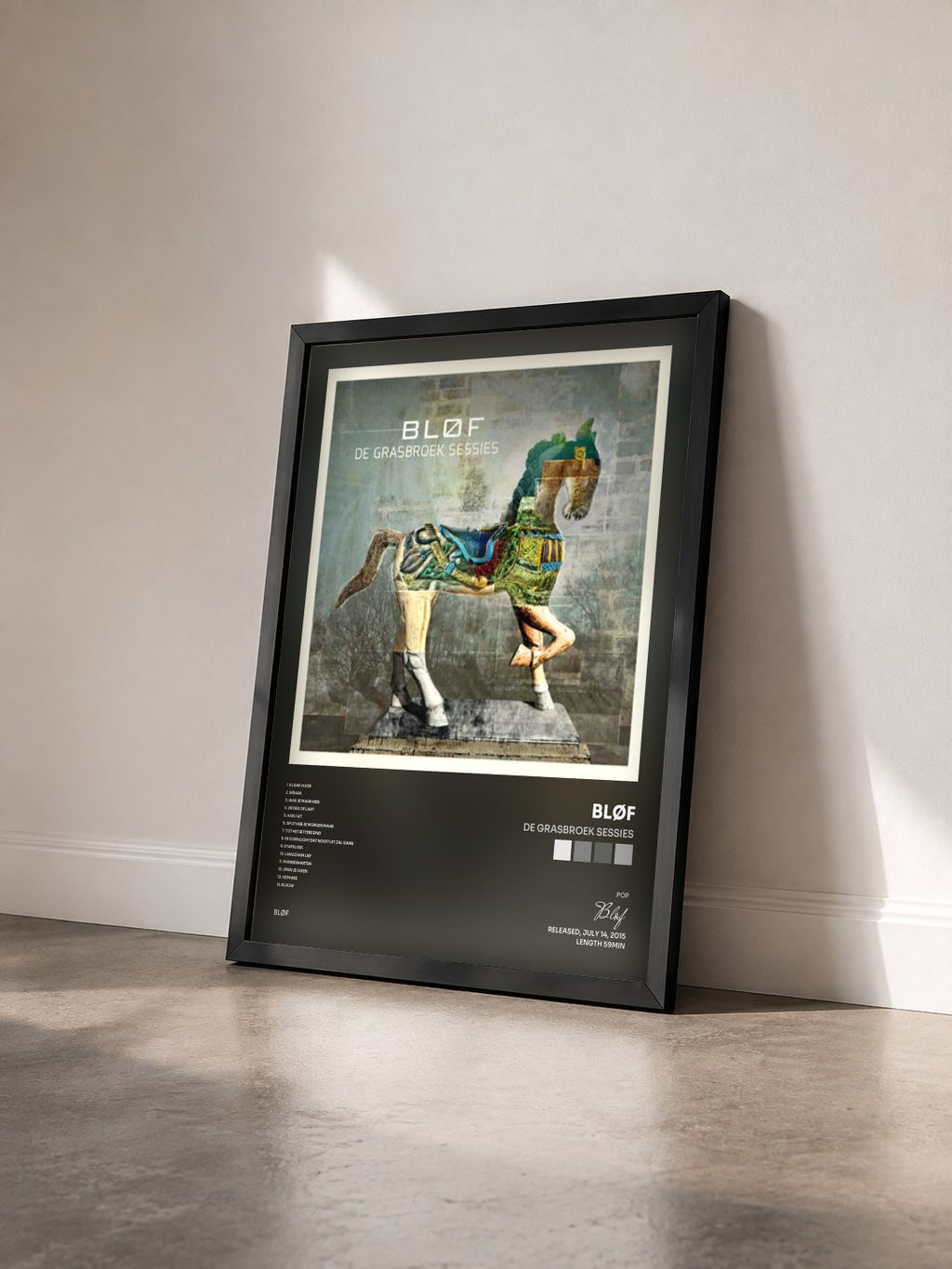 #noir Tableau de l'album De Grasbroek Sessies de Bløf vu de trois quarts, cadre noir