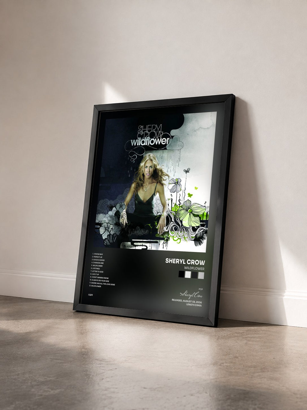 #noir Tableau de l'album Wildflower de Sheryl Crow vu de trois quarts, cadre noir
