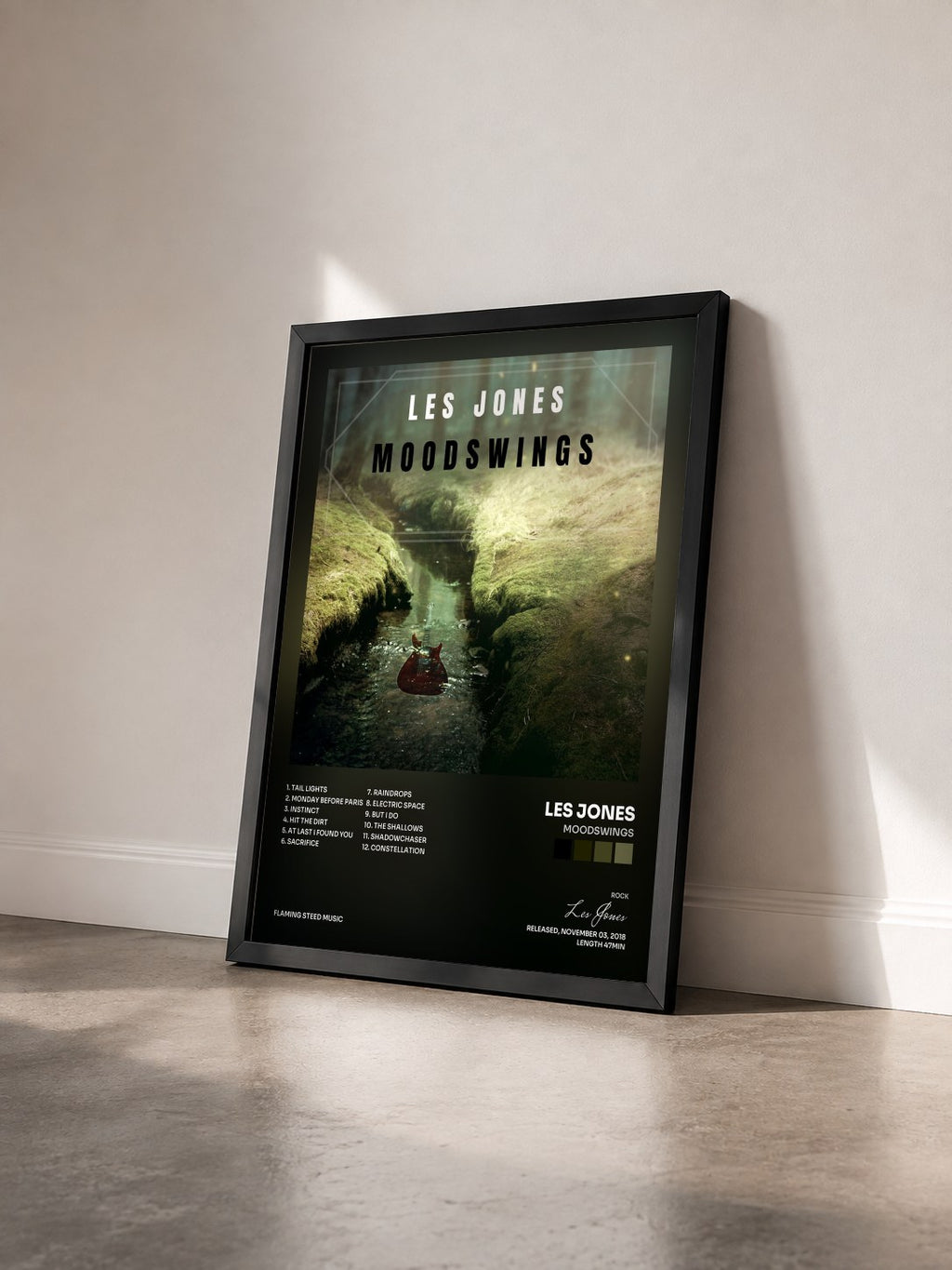 #noir Tableau de l'album Moodswings de Les Jones vu de trois quarts, cadre noir