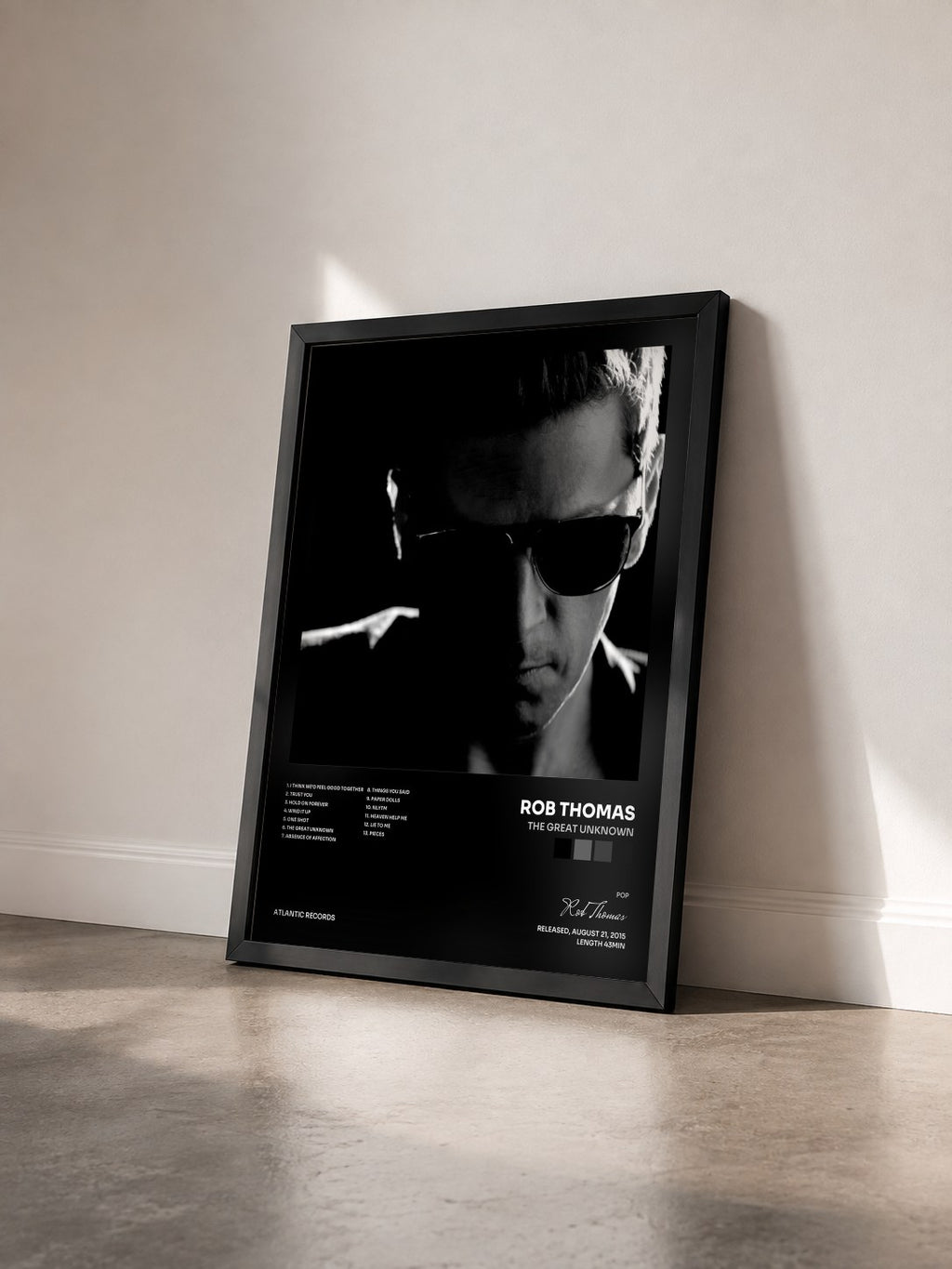 #noir Tableau de l'album The Great Unknown de Rob Thomas vu de trois quarts, cadre noir