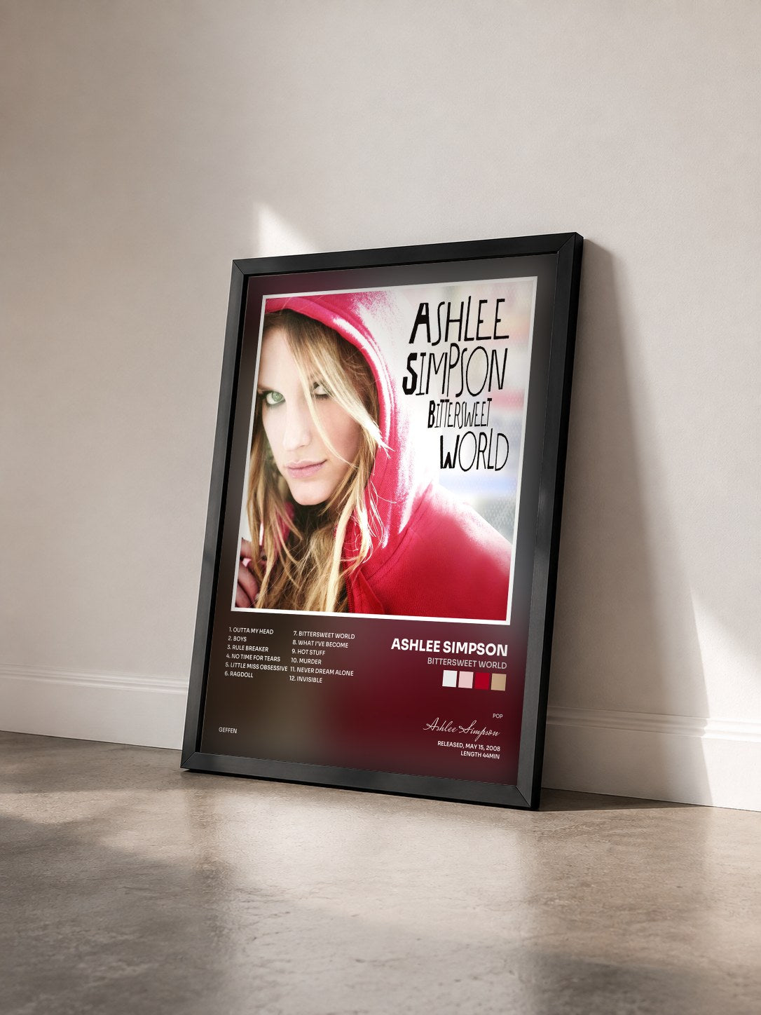 #noir Tableau de l'album Bittersweet World de Ashlee Simpson vu de trois quarts, cadre noir