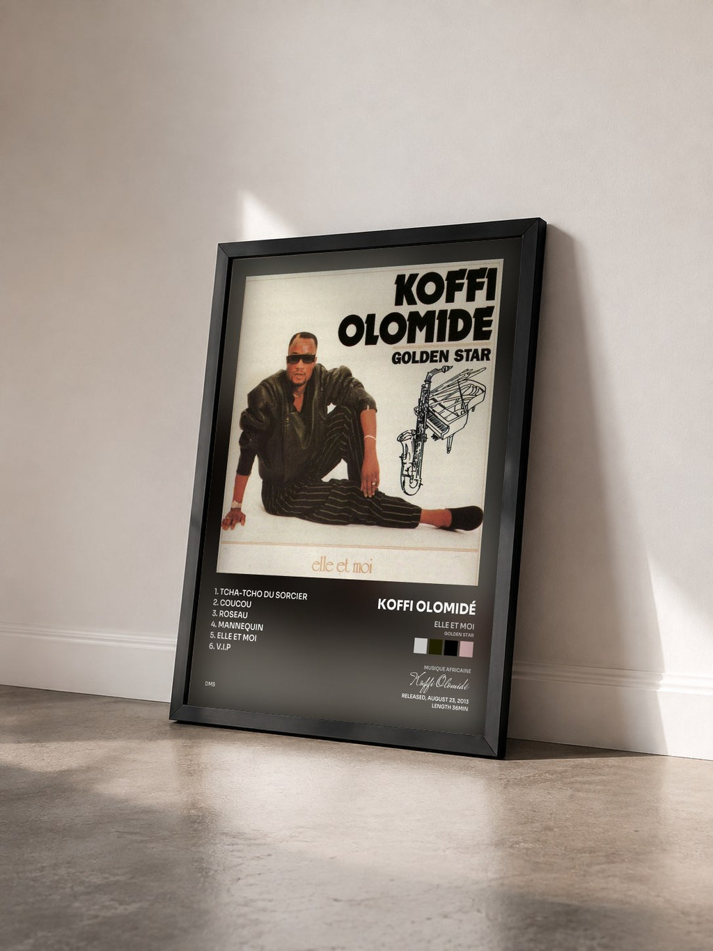 #noir Tableau de l'album Elle et moi (Golden Star) de Koffi Olomidé vu de trois quarts, cadre noir