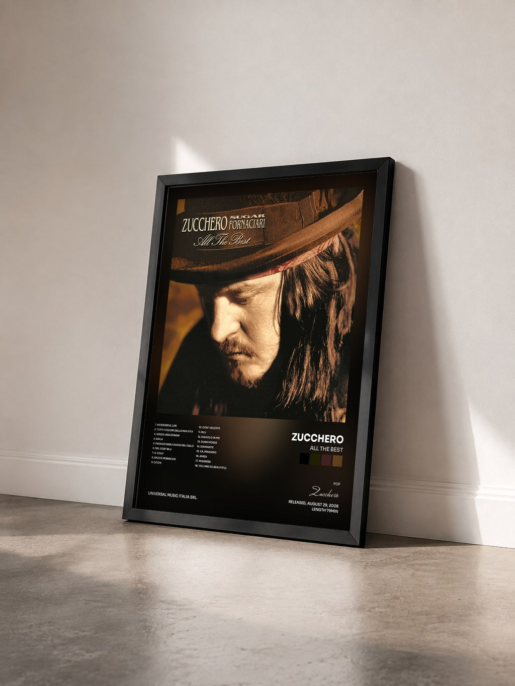 #noir Tableau de l'album All The Best de Zucchero vu de trois quarts, cadre noir
