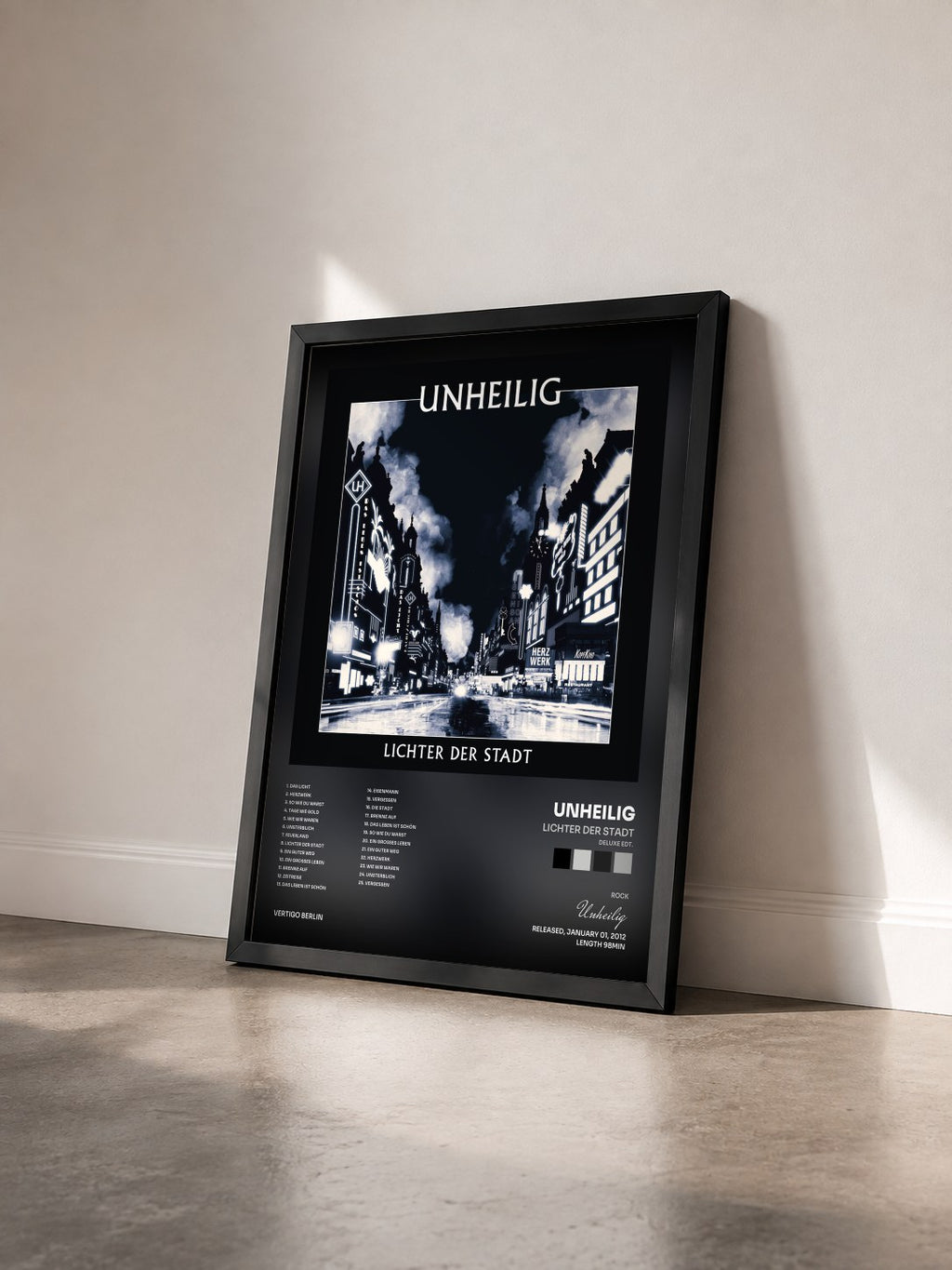 #noir Tableau de l'album Lichter der Stadt (Deluxe Edt.) de Unheilig vu de trois quarts, cadre noir