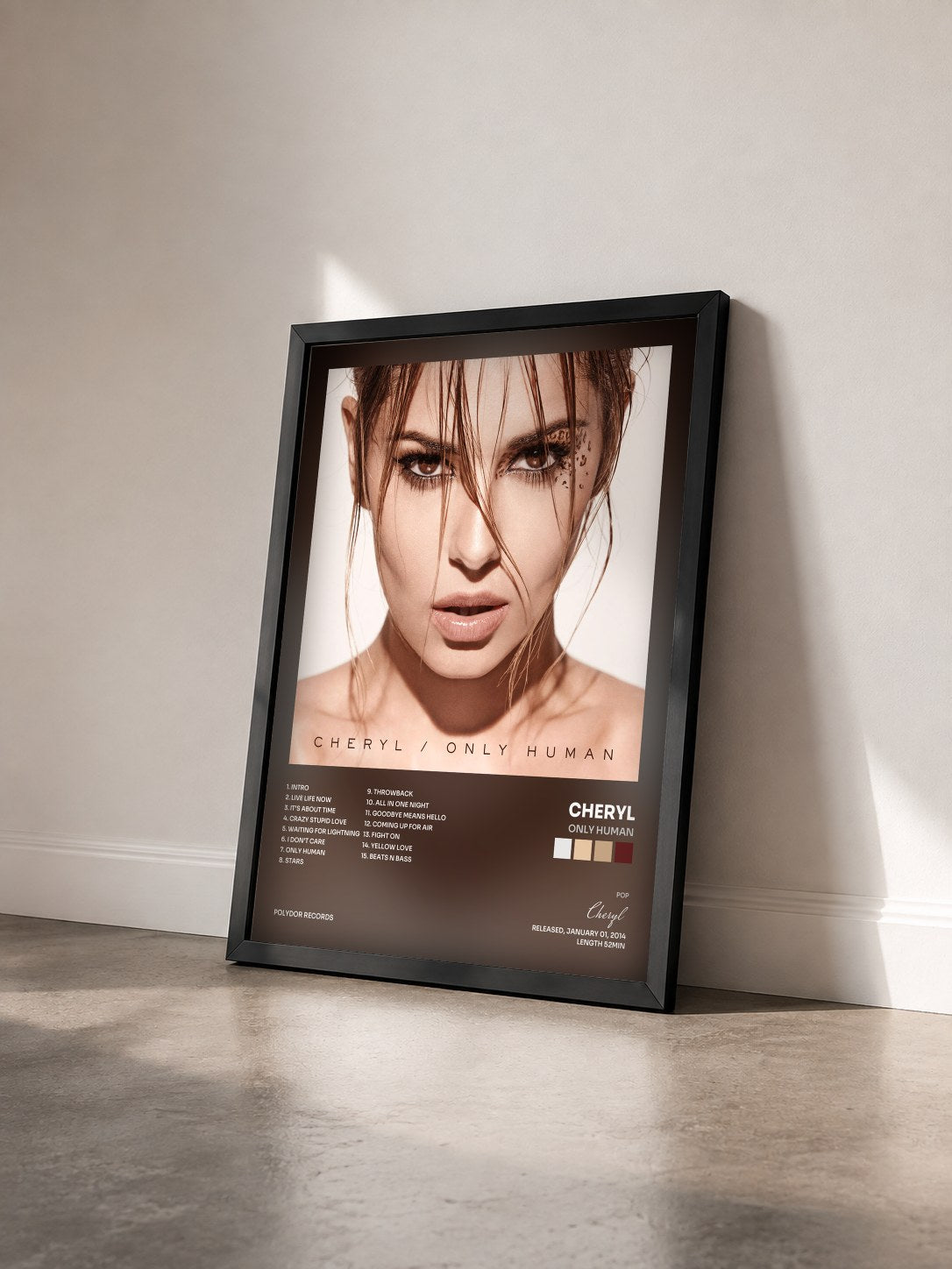 #noir Tableau de l'album Only Human de Cheryl vu de trois quarts, cadre noir