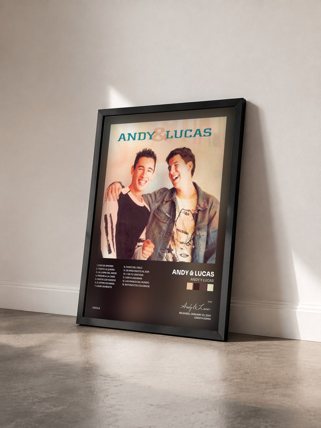 #noir Tableau de l'album Andy Y Lucas de Andy & Lucas vu de trois quarts, cadre noir