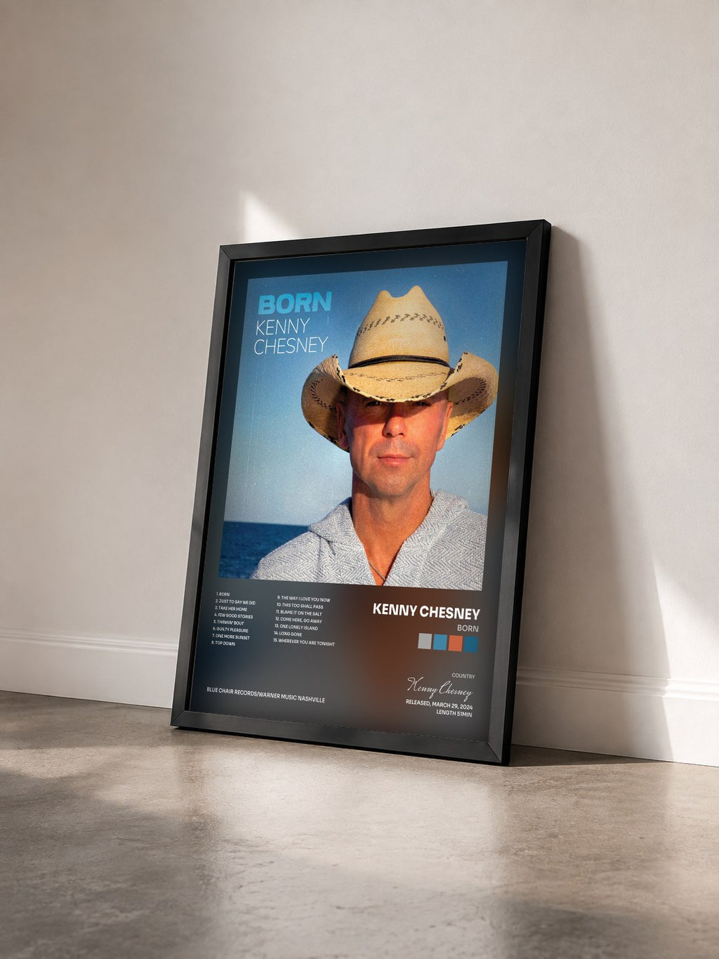#noir Tableau de l'album Born de Kenny Chesney vu de trois quarts, cadre noir