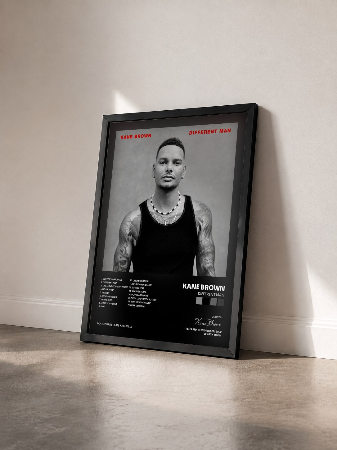 #noir Tableau de l'album Different Man de Kane Brown vu de trois quarts, cadre noir