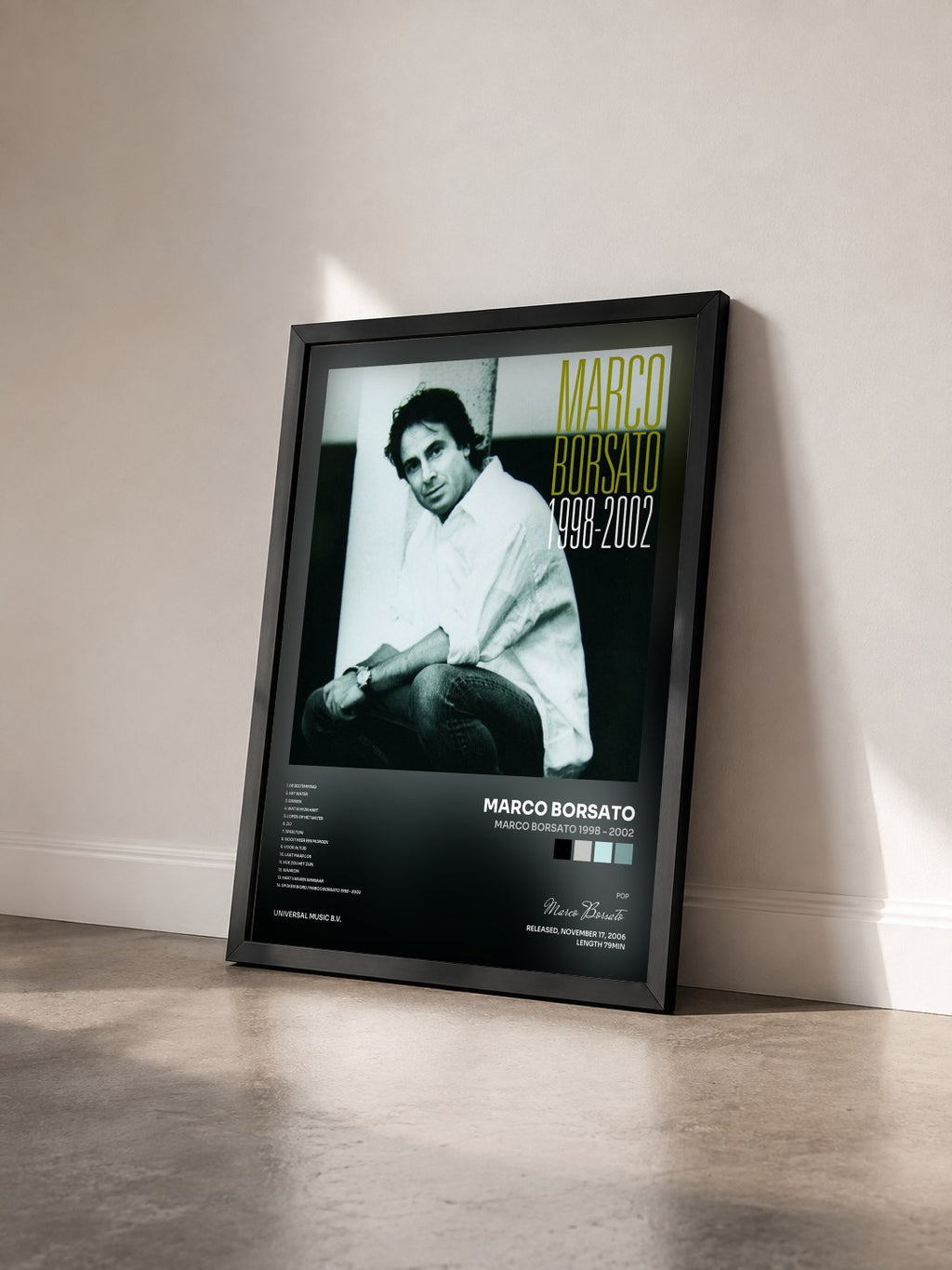 #noir Tableau de l'album Marco Borsato 1998 - 2002 de Marco Borsato vu de trois quarts, cadre noir