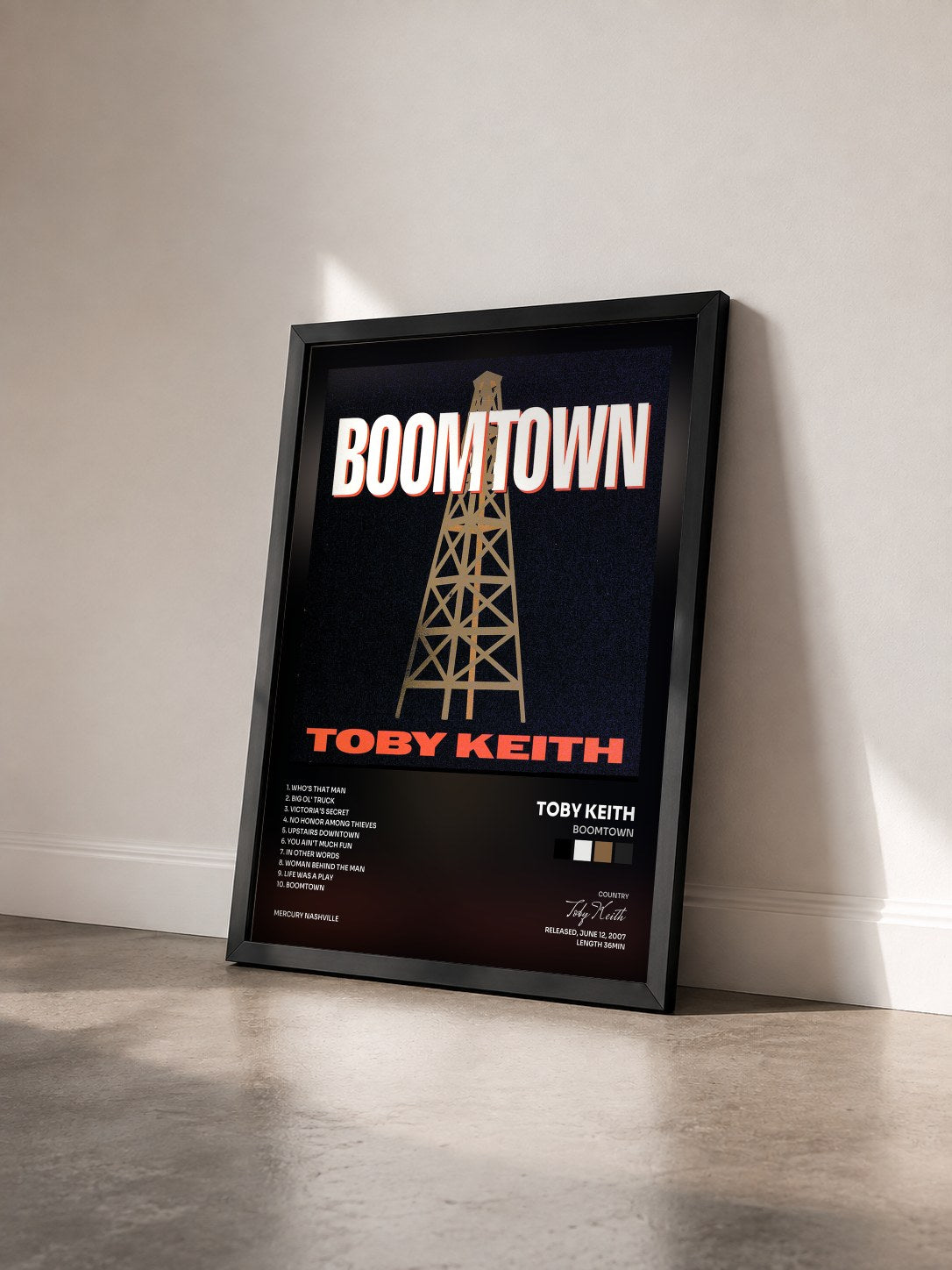 #noir Tableau de l'album Boomtown de Toby Keith vu de trois quarts, cadre noir