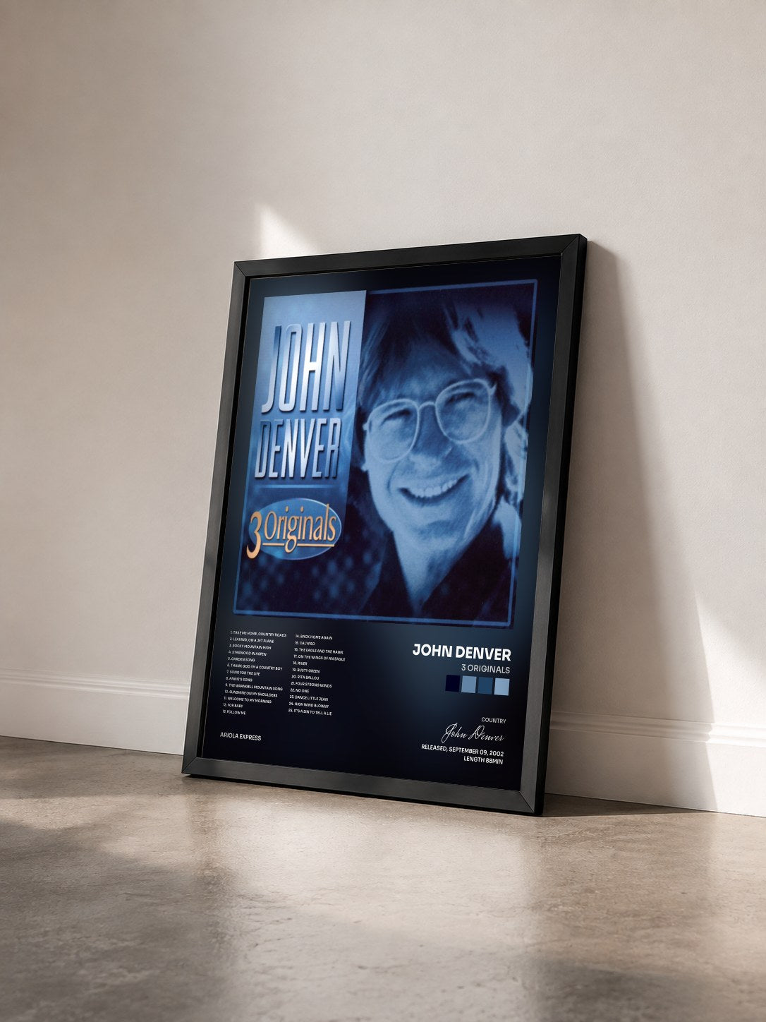 #noir Tableau de l'album 3 Originals de John Denver vu de trois quarts, cadre noir