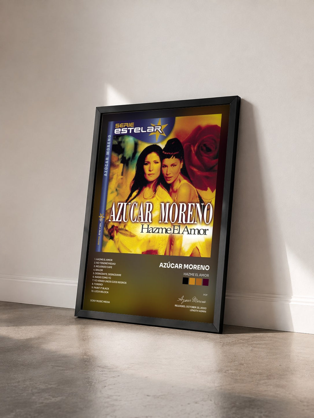 #noir Tableau de l'album Hazme El Amor de Azúcar Moreno vu de trois quarts, cadre noir