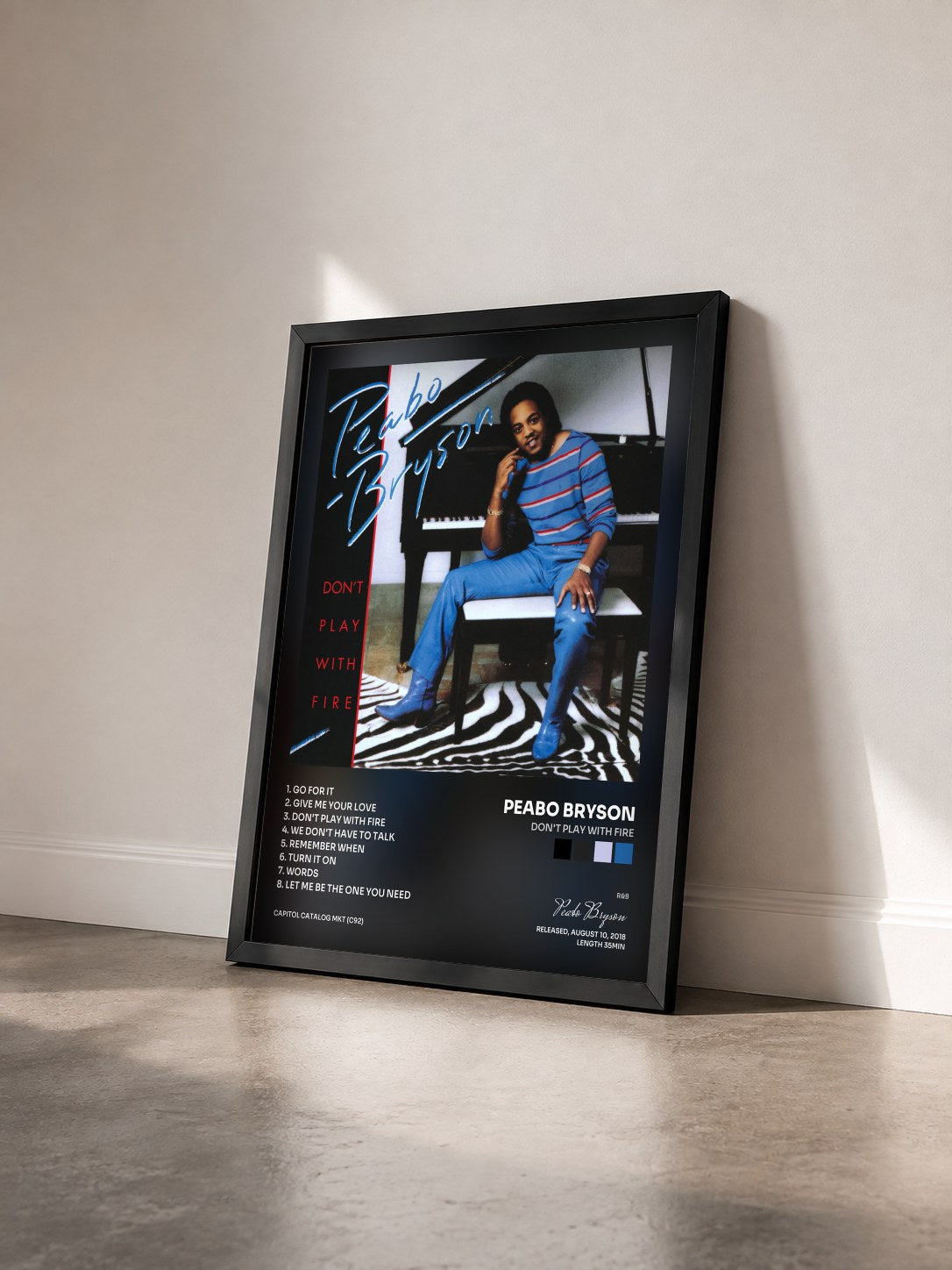 #noir Tableau de l'album Don't Play With Fire de Peabo Bryson vu de trois quarts, cadre noir