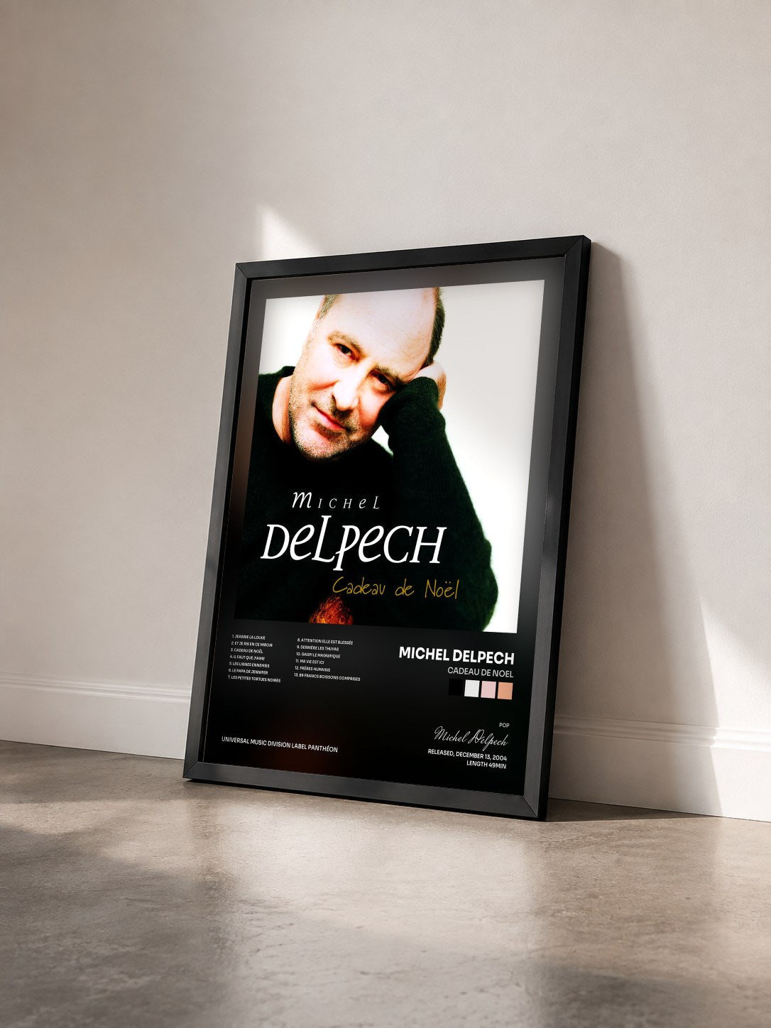 #noir Tableau de l'album Cadeau De Noel de Michel Delpech vu de trois quarts, cadre noir