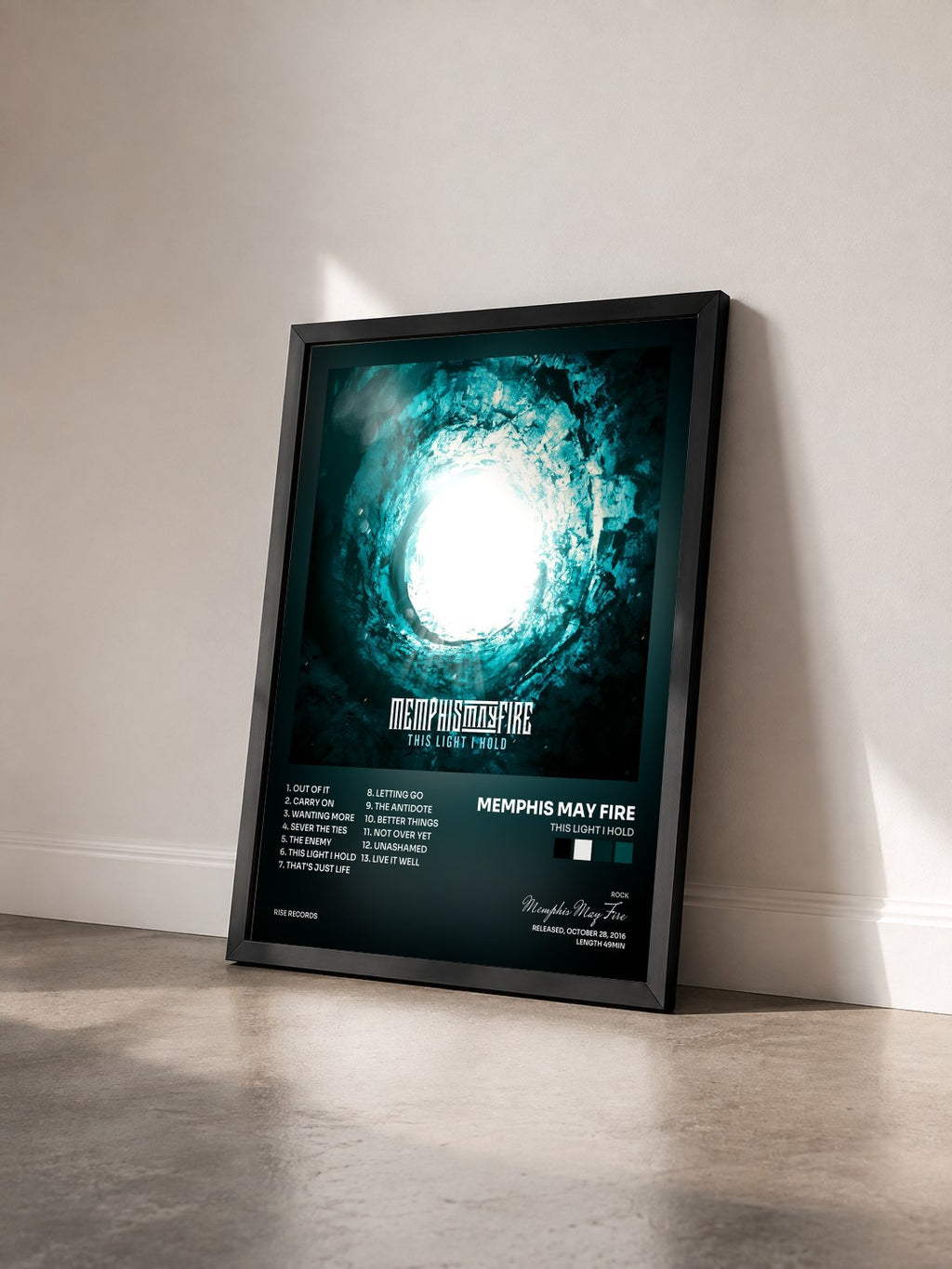 #noir Tableau de l'album This Light I Hold de Memphis May Fire vu de trois quarts, cadre noir