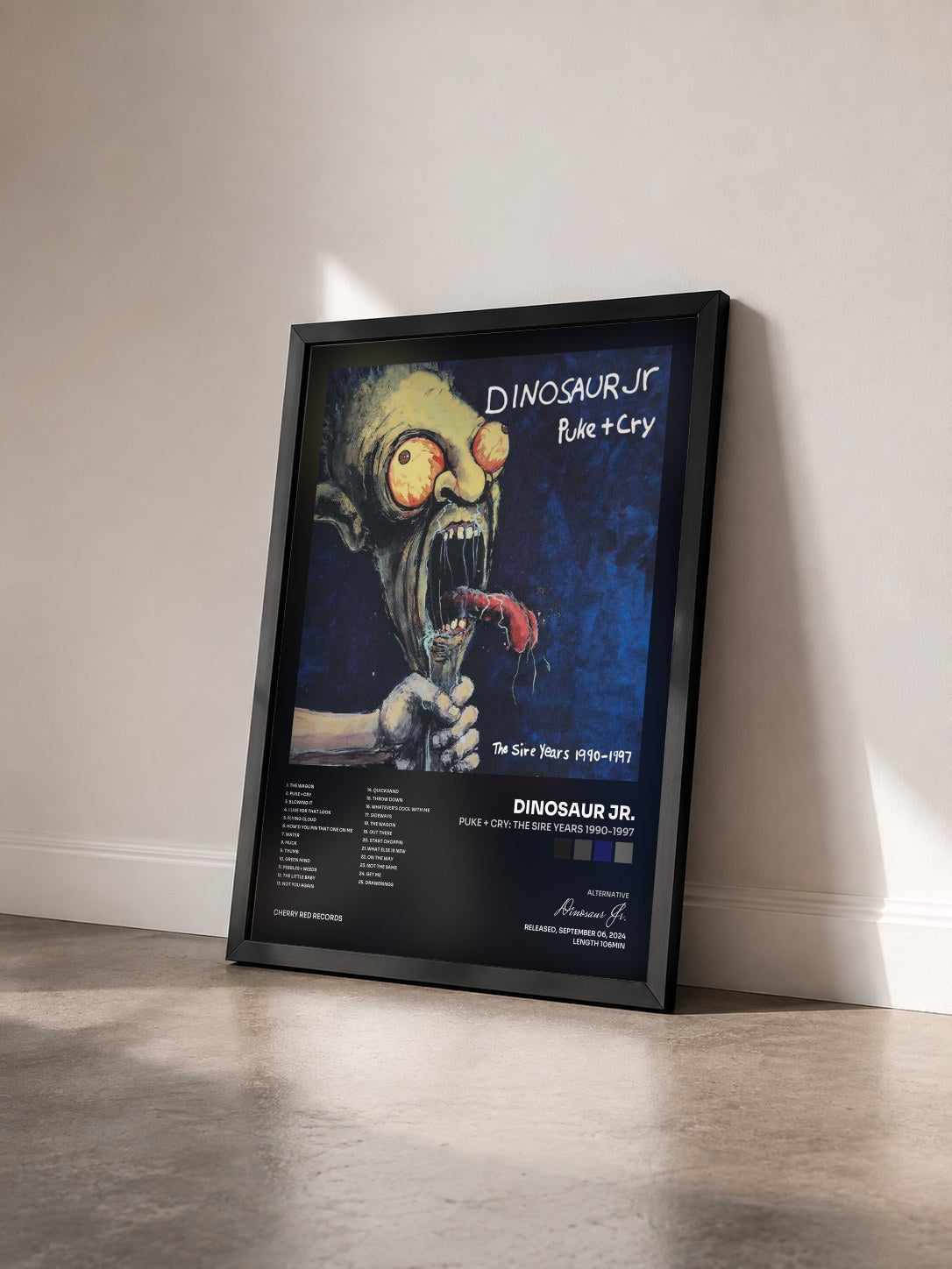 #noir Tableau de l'album Puke + Cry: The Sire Years 1990-1997 de Dinosaur Jr. vu de trois quarts, cadre noir