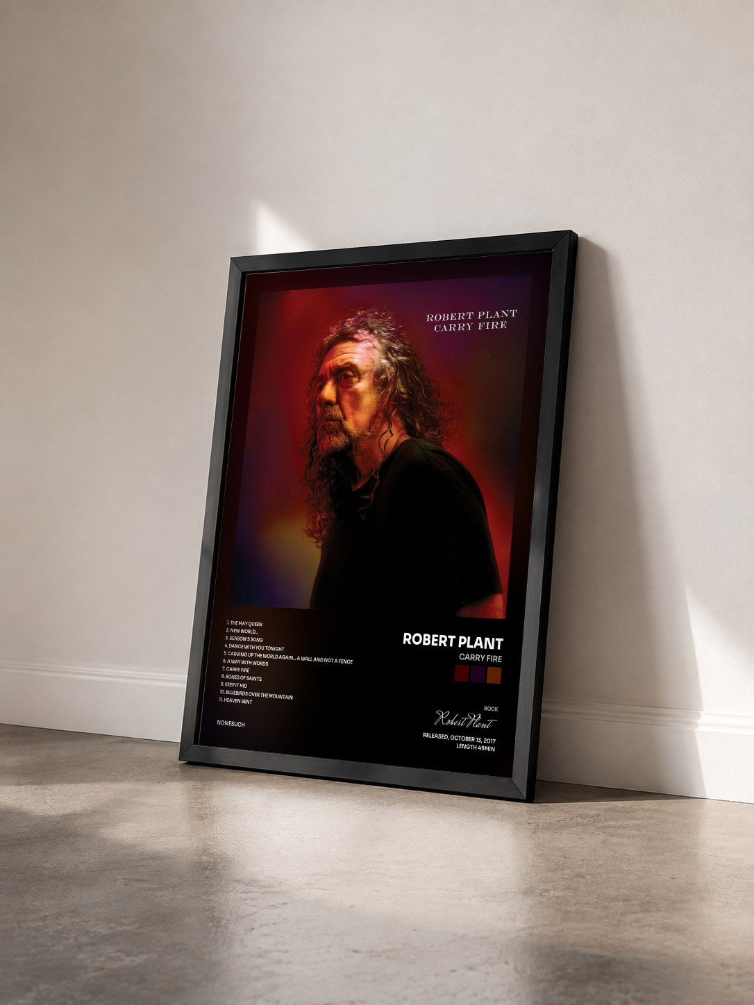 #noir Tableau de l'album Carry Fire de Robert Plant vu de trois quarts, cadre noir