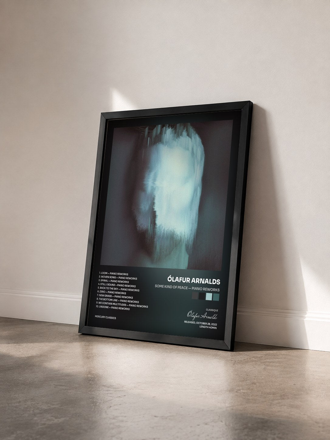 #noir Tableau de l'album some kind of peace — piano reworks de Ólafur Arnalds vu de trois quarts, cadre noir