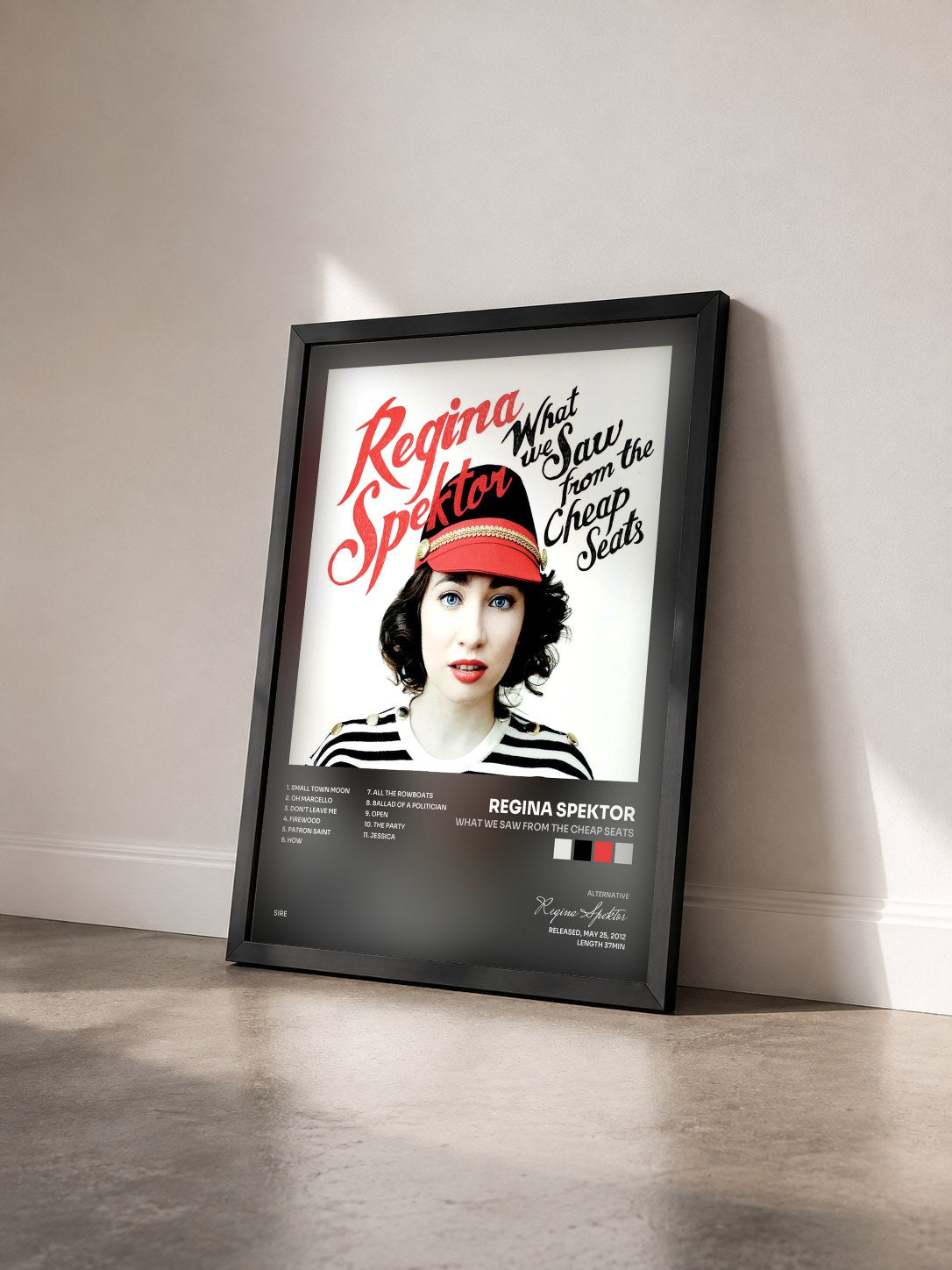 #noir Tableau de l'album What We Saw from the Cheap Seats de Regina Spektor vu de trois quarts, cadre noir