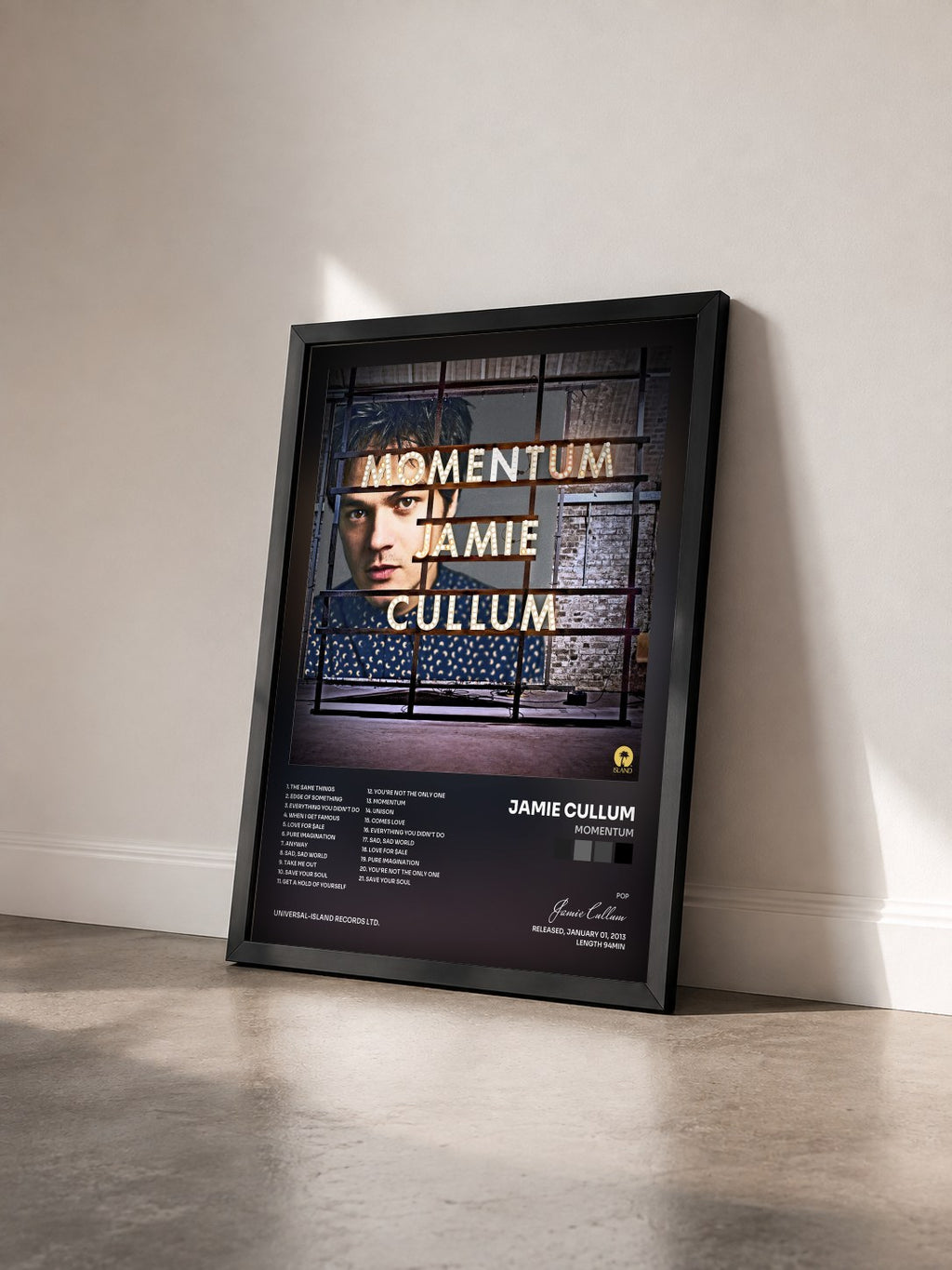 #noir Tableau de l'album Momentum de Jamie Cullum vu de trois quarts, cadre noir