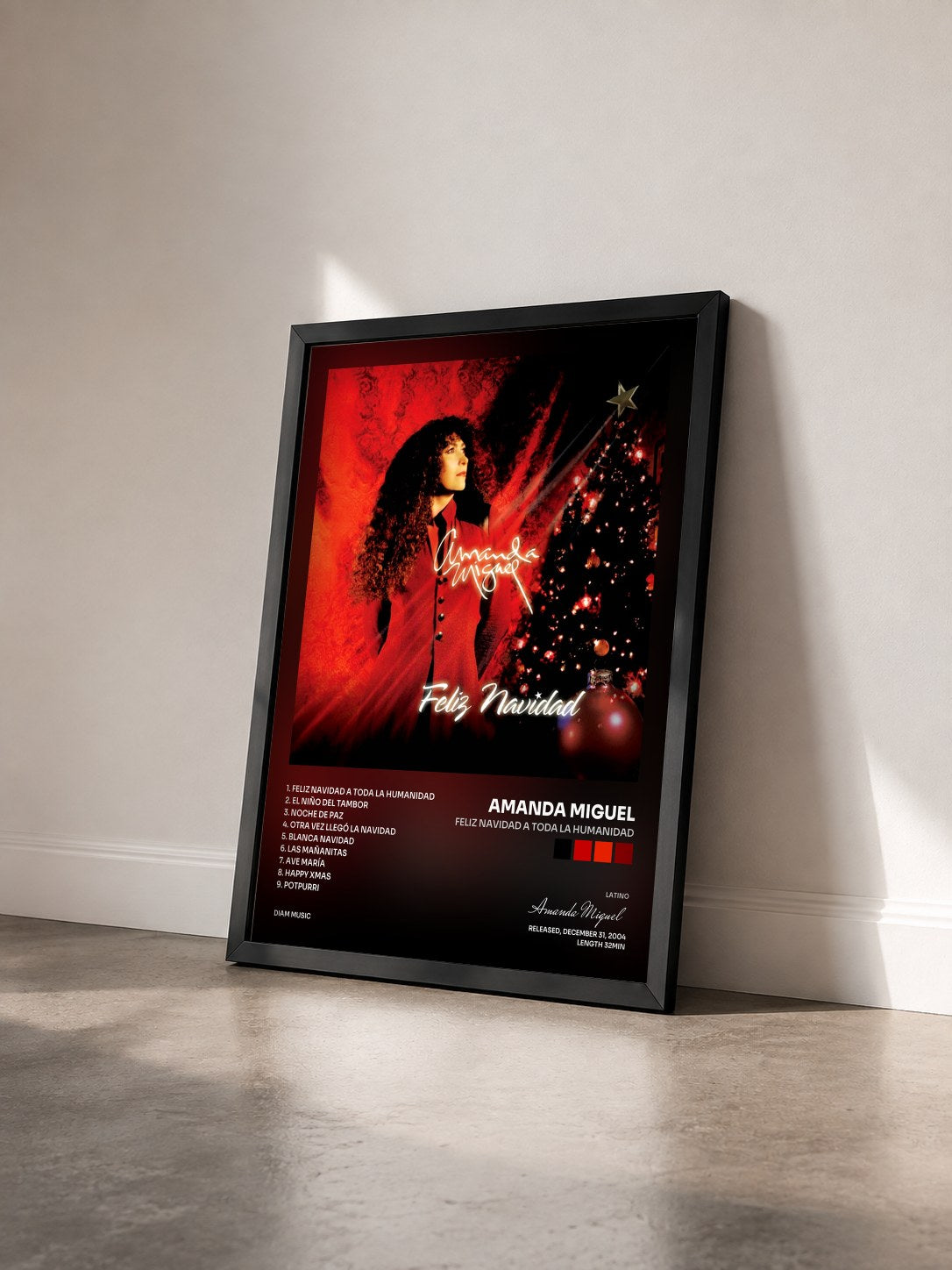 #noir Tableau de l'album Feliz Navidad A Toda La Humanidad de Amanda Miguel vu de trois quarts, cadre noir