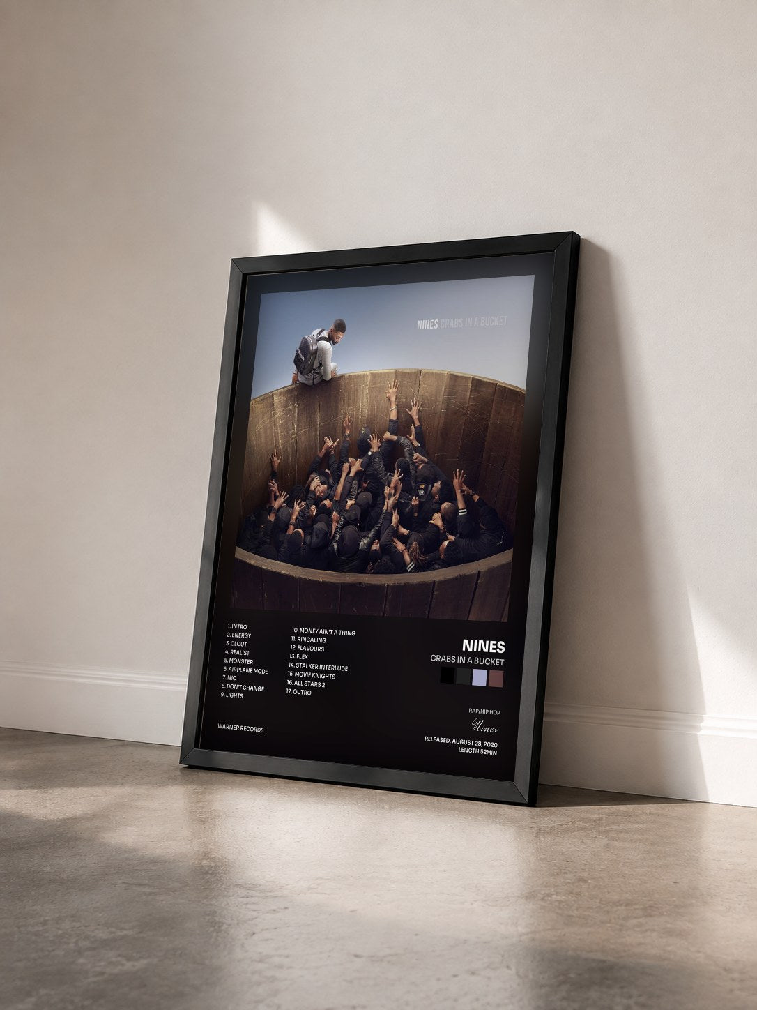 #noir Tableau de l'album Crabs In A Bucket de Nines vu de trois quarts, cadre noir