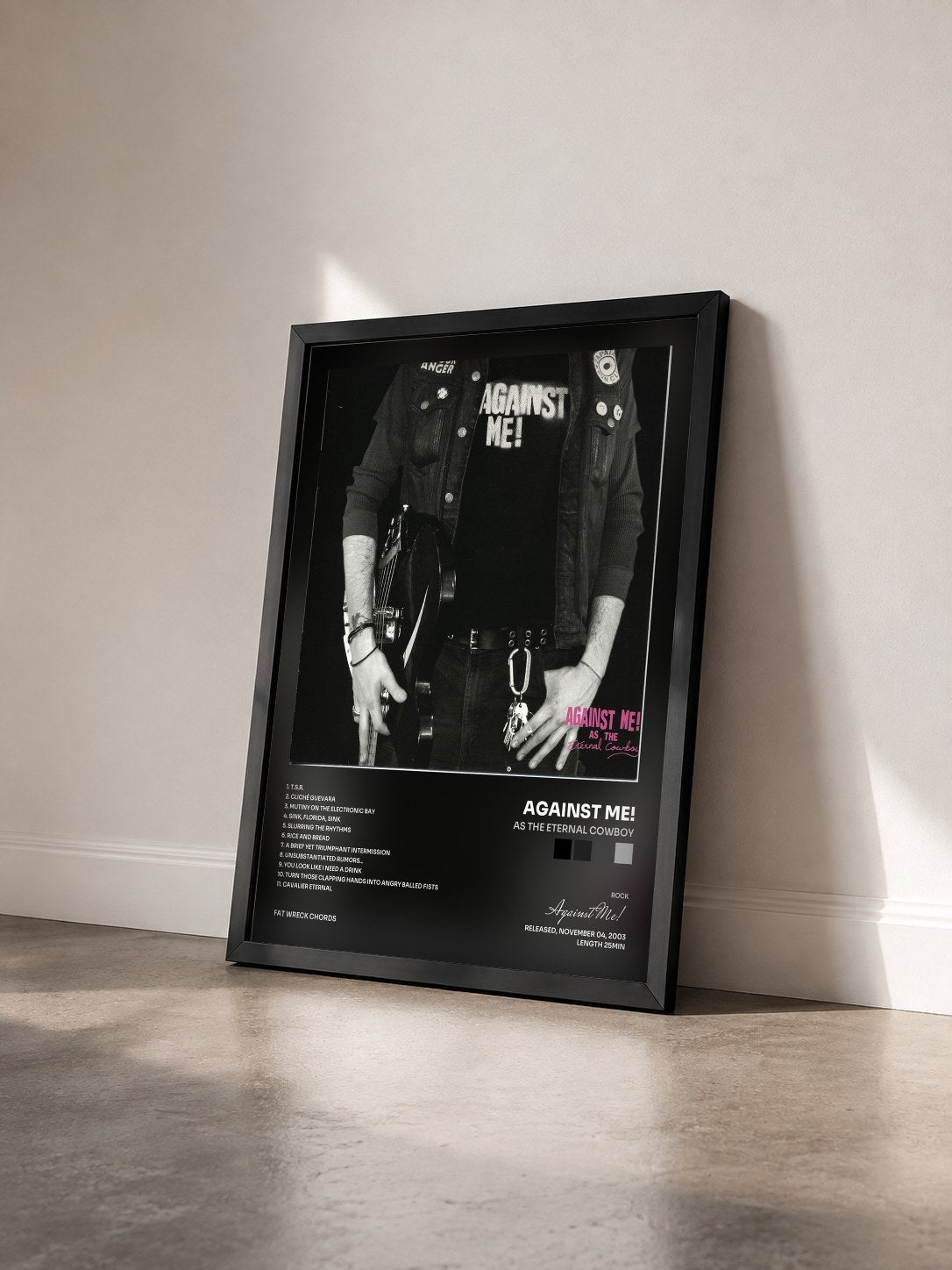 #noir Tableau de l'album As the Eternal Cowboy de Against Me! vu de trois quarts, cadre noir
