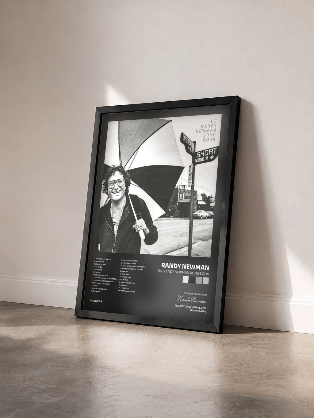 #noir Tableau de l'album The Randy Newman Songbook de Randy Newman vu de trois quarts, cadre noir