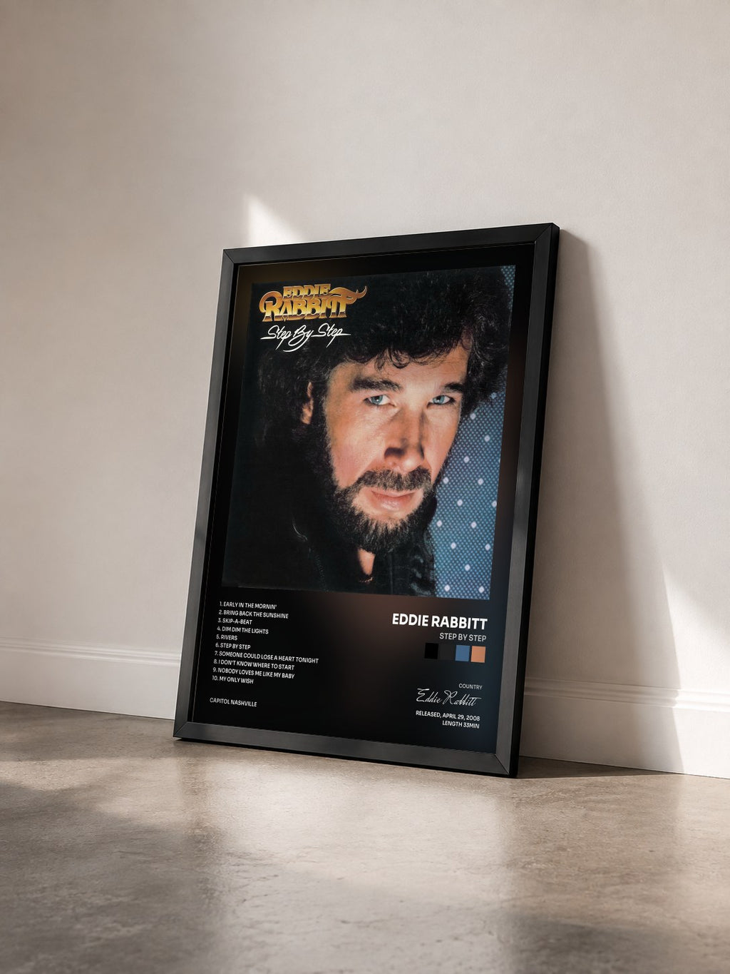 #noir Tableau de l'album Step By Step de Eddie Rabbitt vu de trois quarts, cadre noir