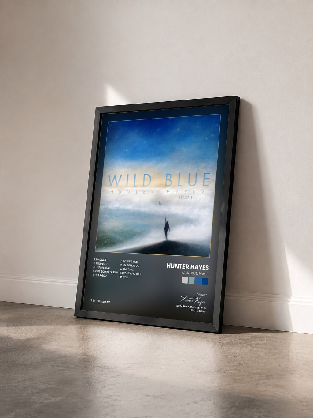 #noir Tableau de l'album Wild Blue, Part I de Hunter Hayes vu de trois quarts, cadre noir