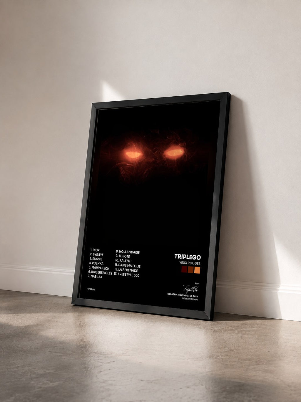 #noir Tableau de l'album Yeux rouges de TripleGo vu de trois quarts, cadre noir