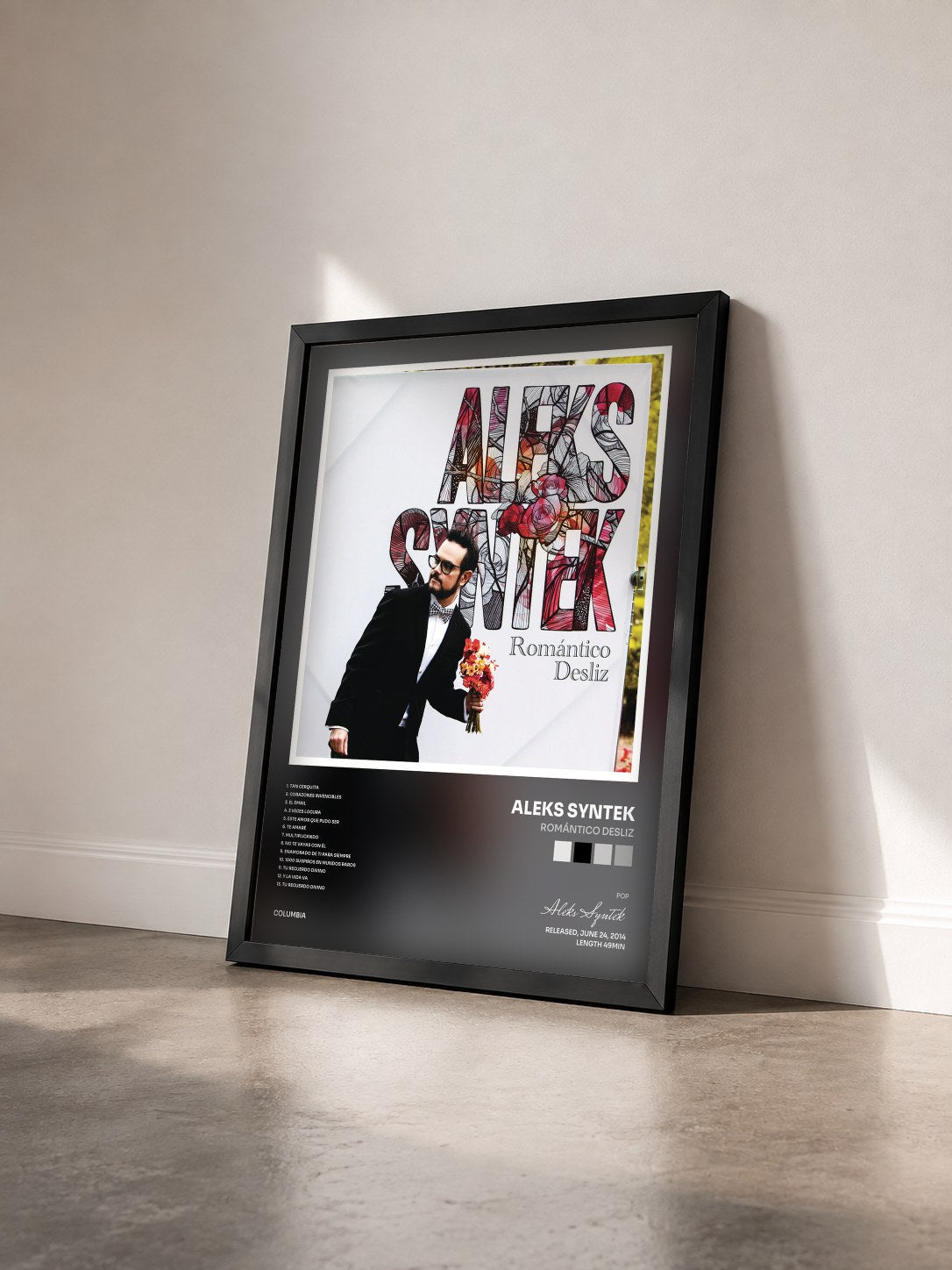 #noir Tableau de l'album Romántico Desliz de Aleks Syntek vu de trois quarts, cadre noir